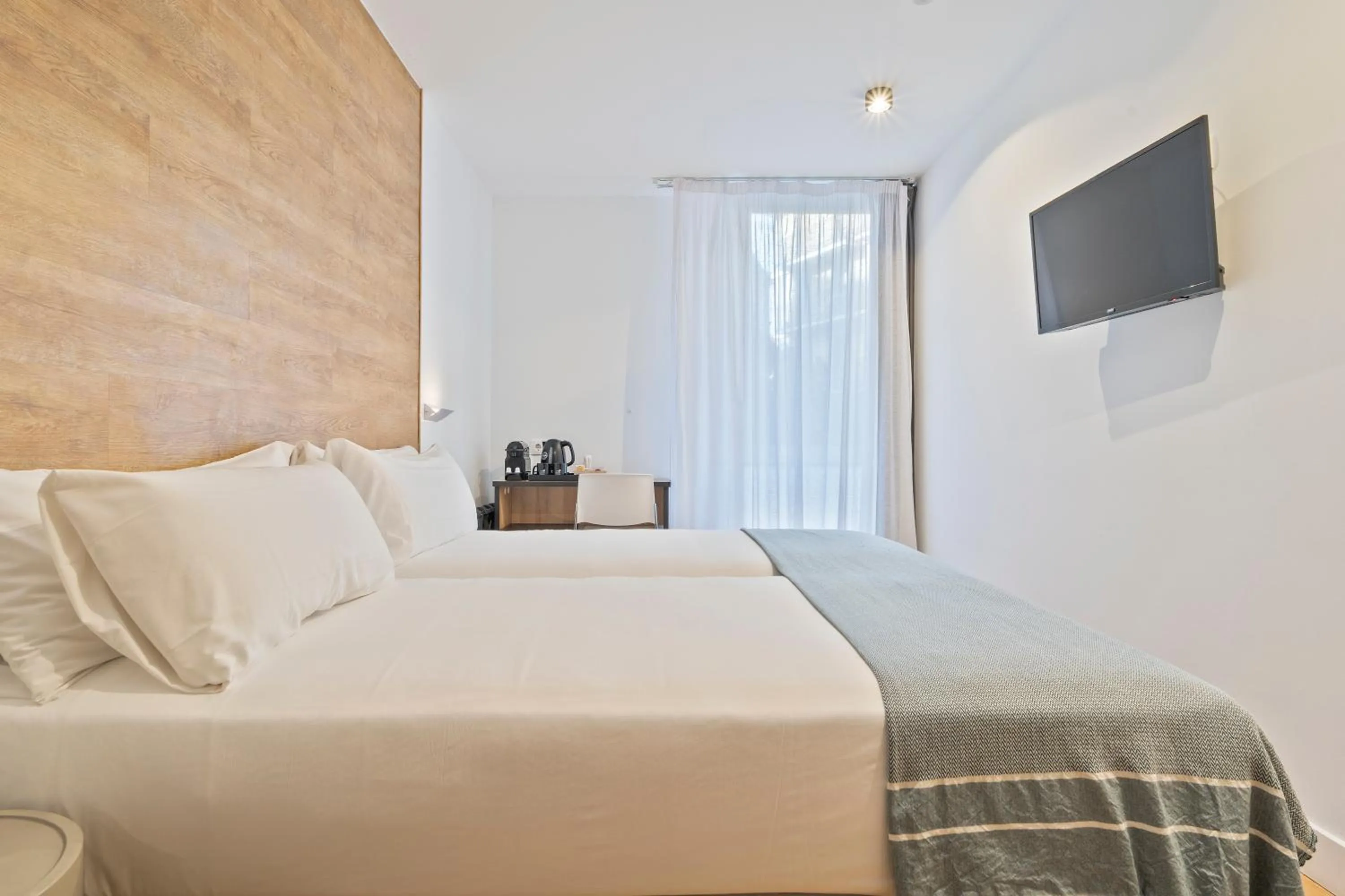 Bed in Uma Suites Ondarreta