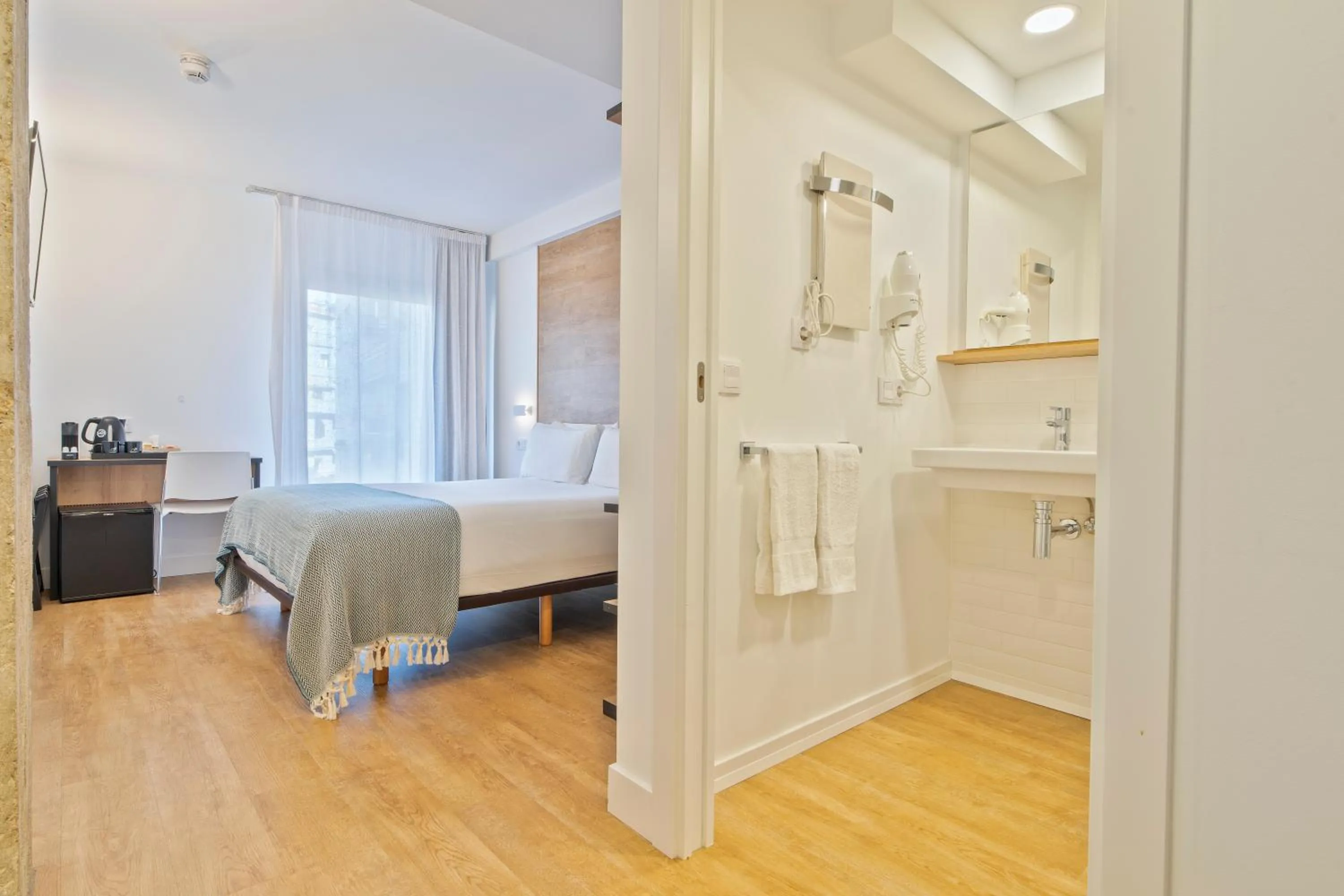 Bed in Uma Suites Ondarreta