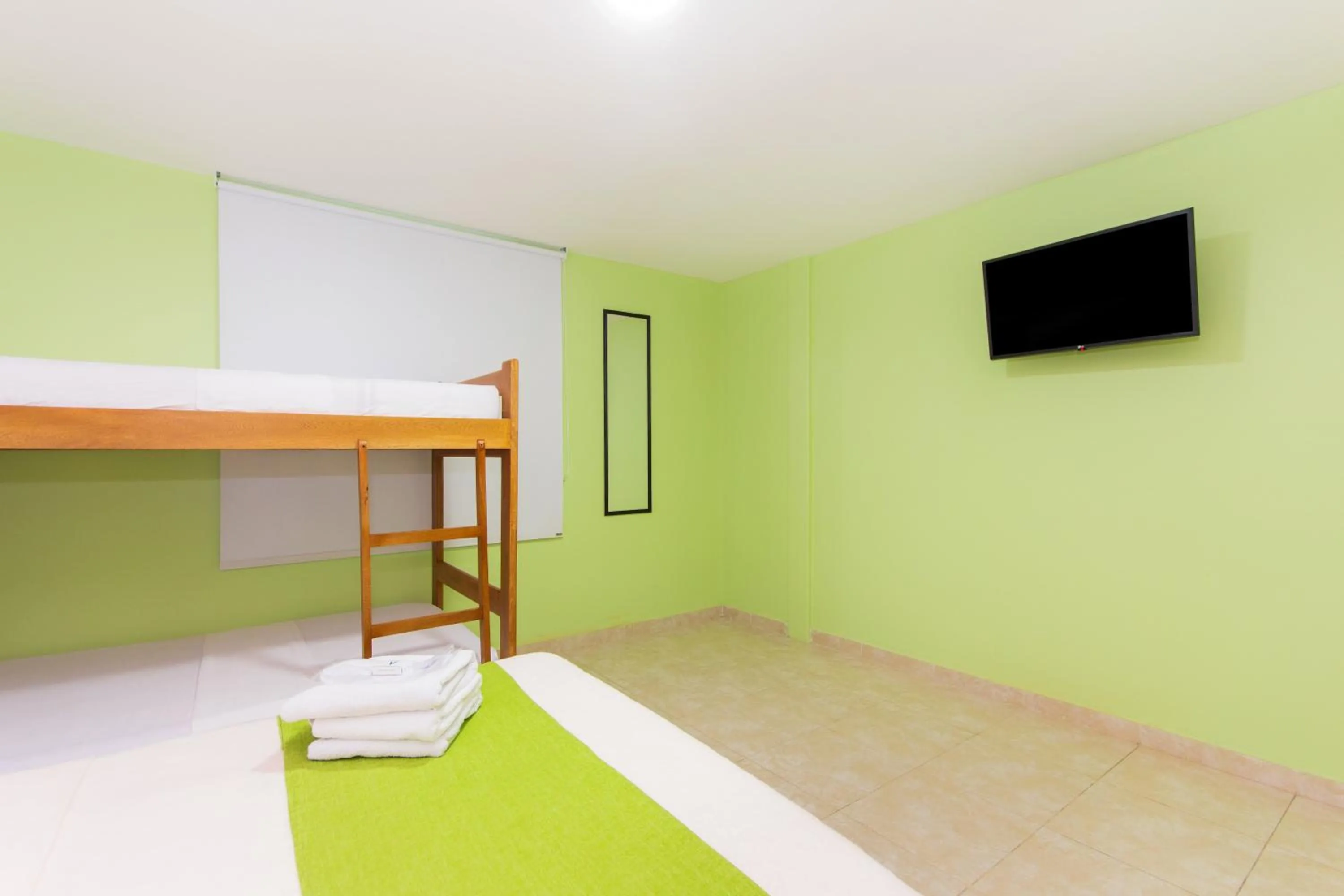 Bed in Hotel Avexi Suites By GEH Suites