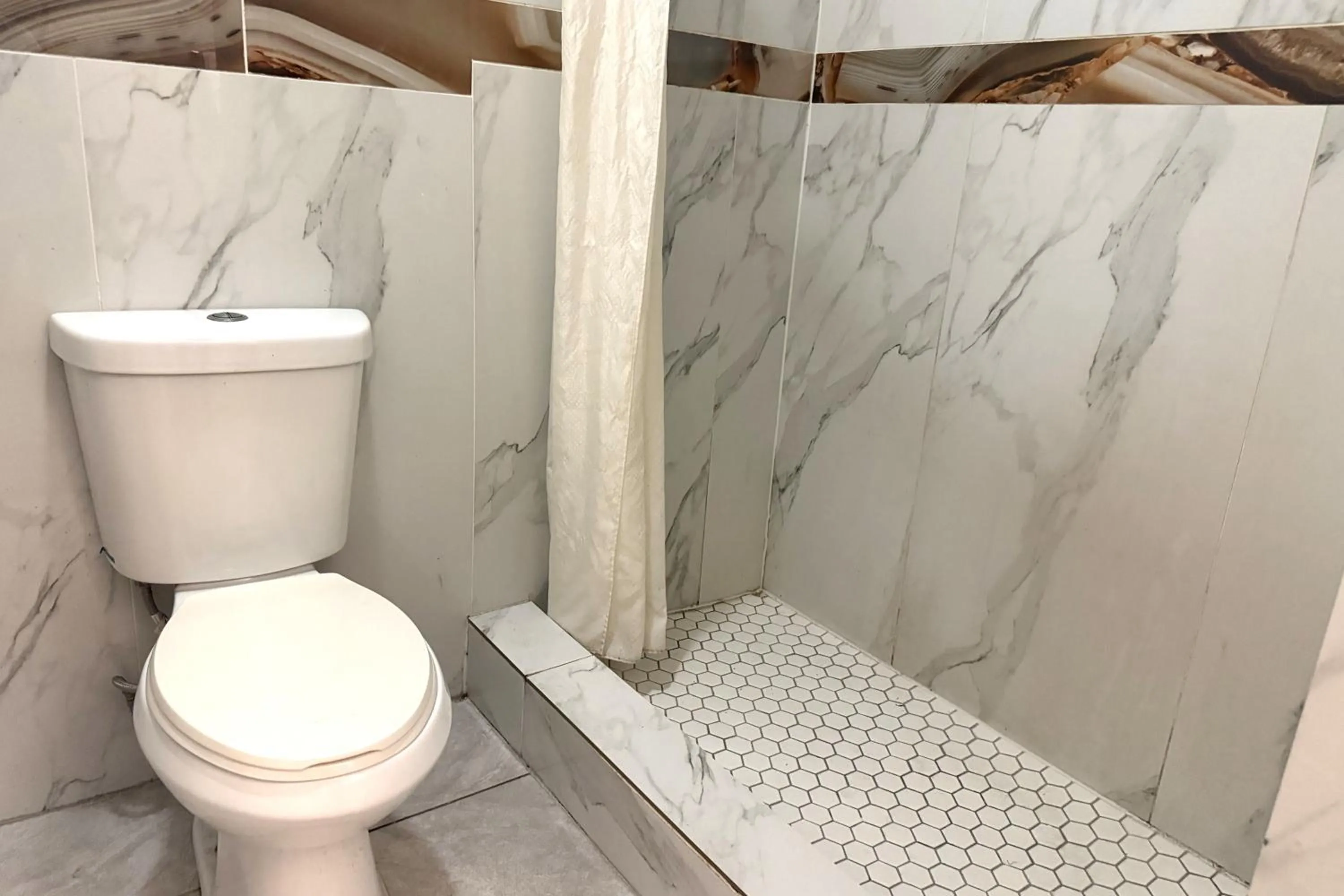 Bathroom in Hotel O Regency Suites Houston - IAH Beltway 8