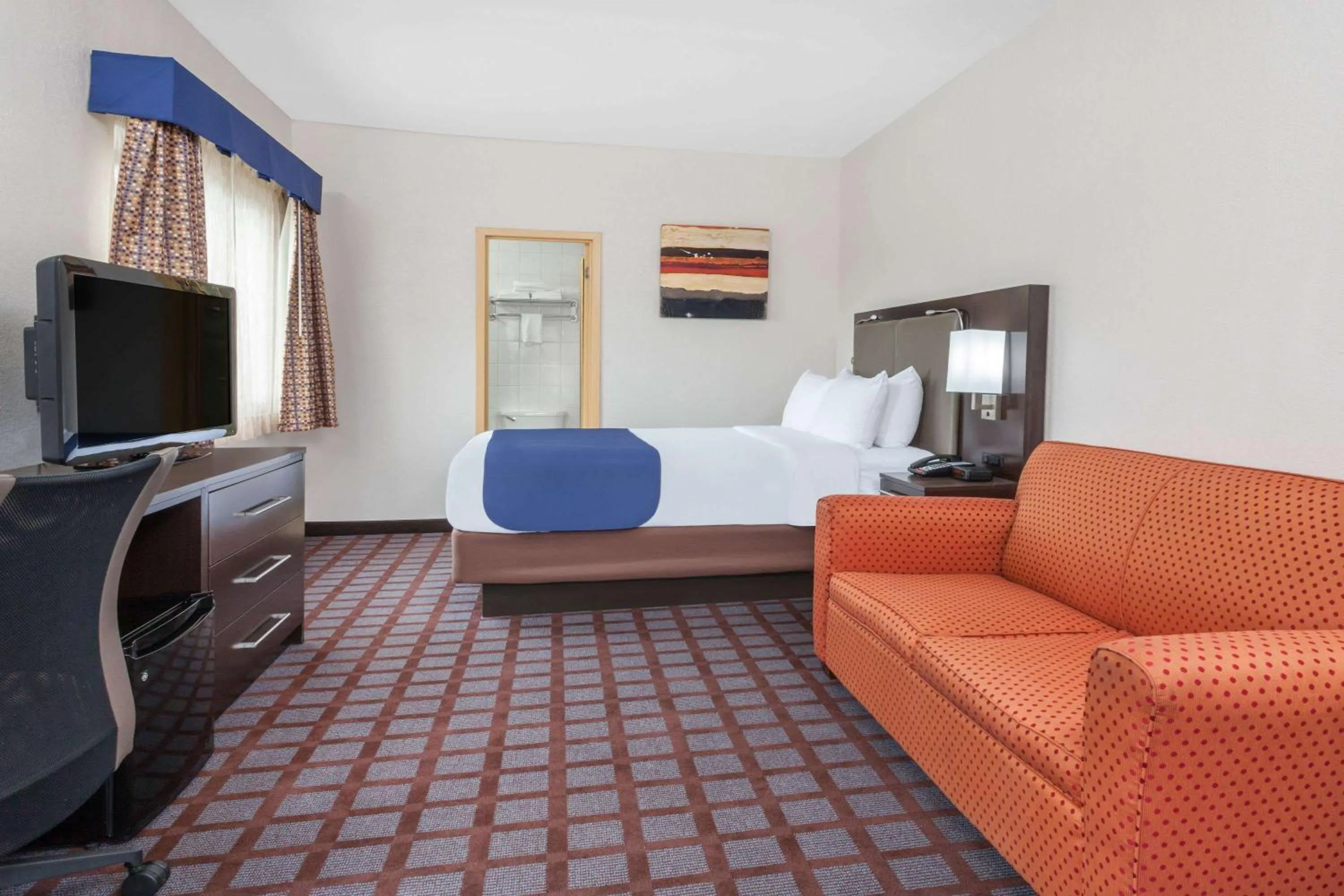 Photo of the whole room, Bed in Days Inn by Wyndham Woodbury Long Island
