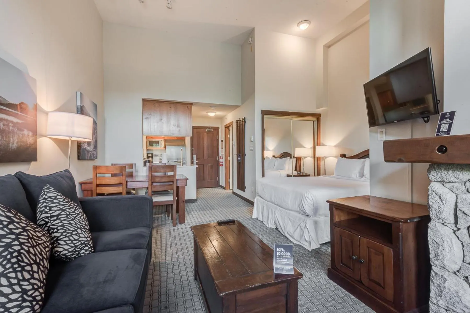 Communal lounge/ TV room in Blackcomb Springs Suites by CLIQUE