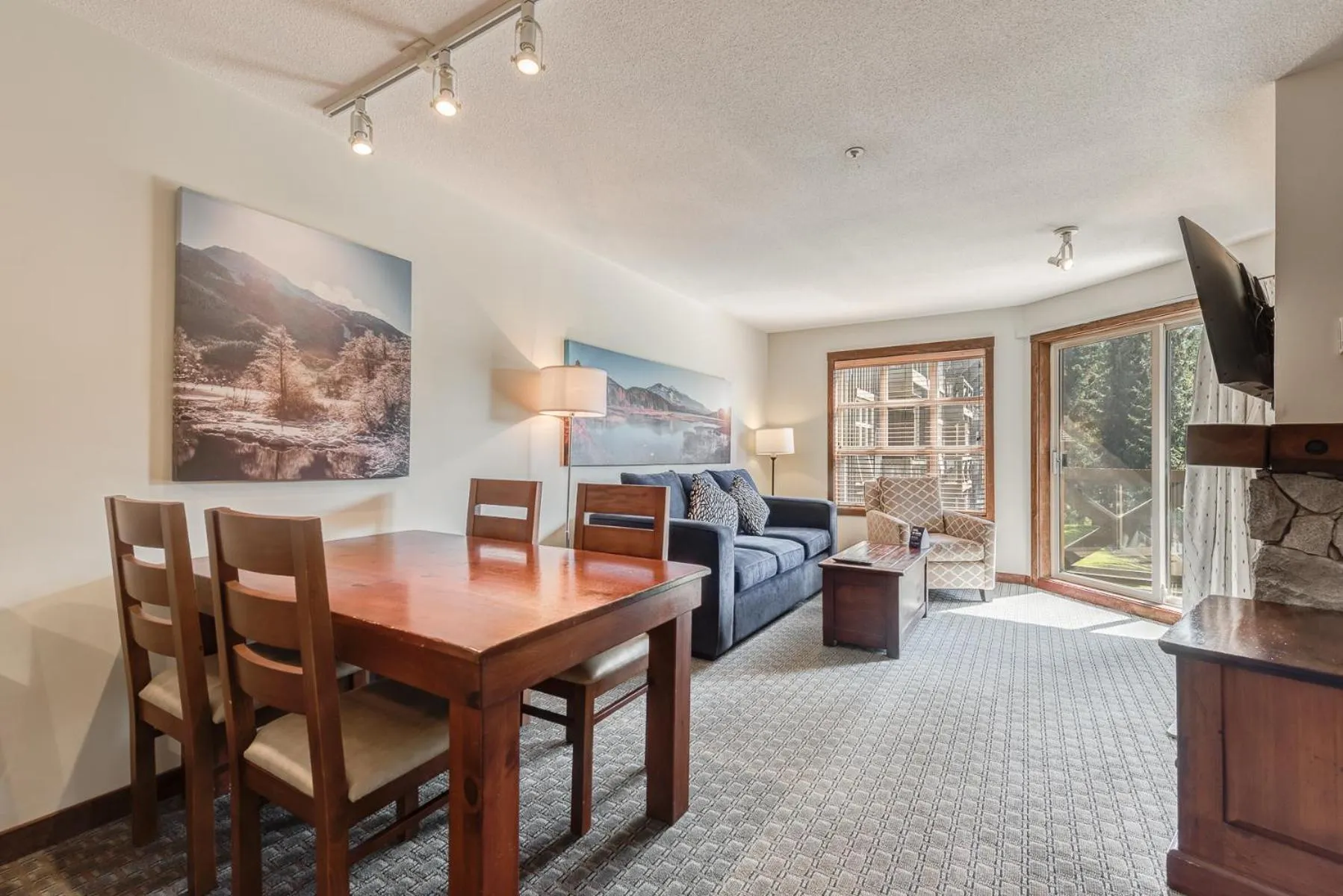 TV and multimedia in Blackcomb Springs Suites by CLIQUE