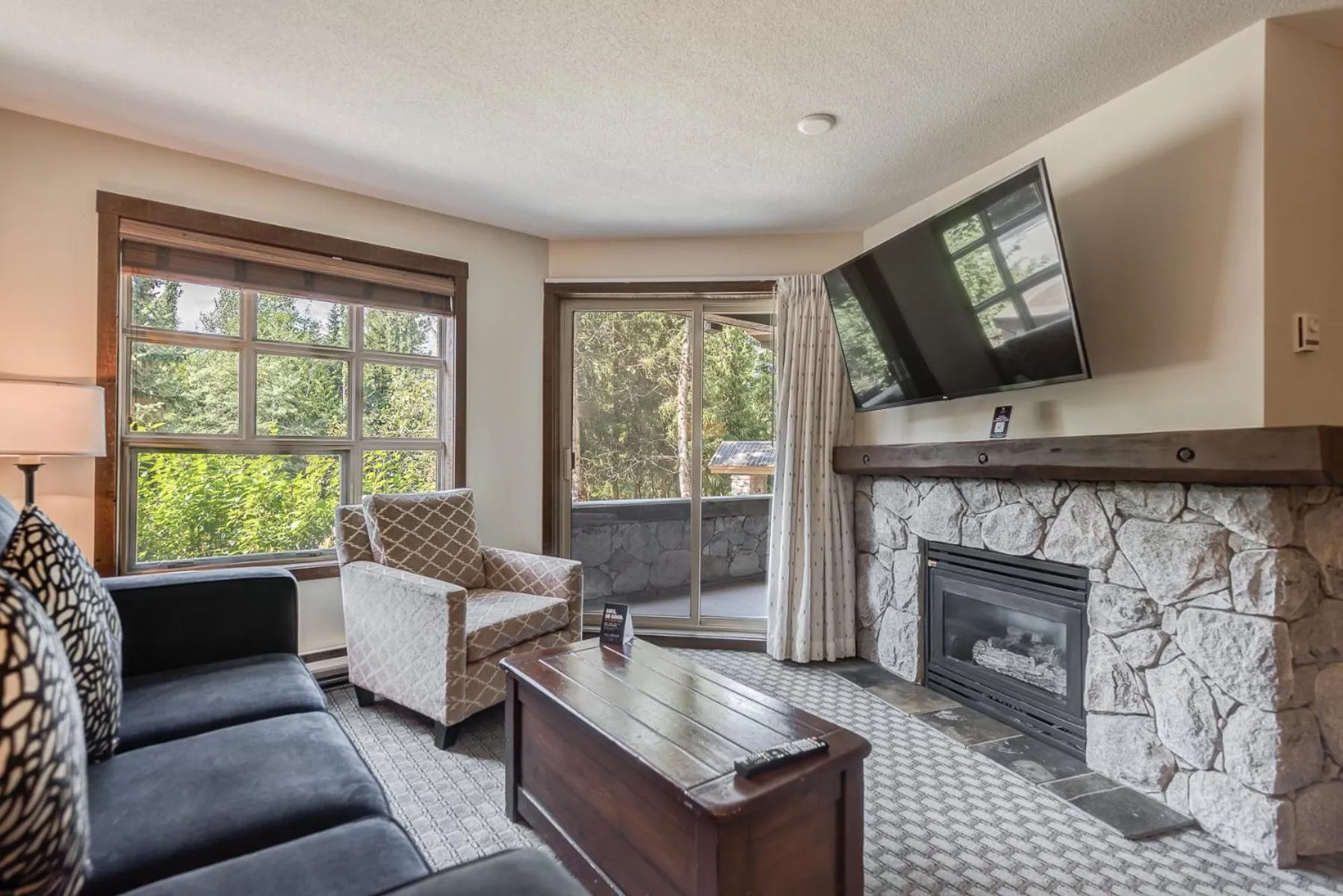 TV and multimedia in Blackcomb Springs Suites by CLIQUE