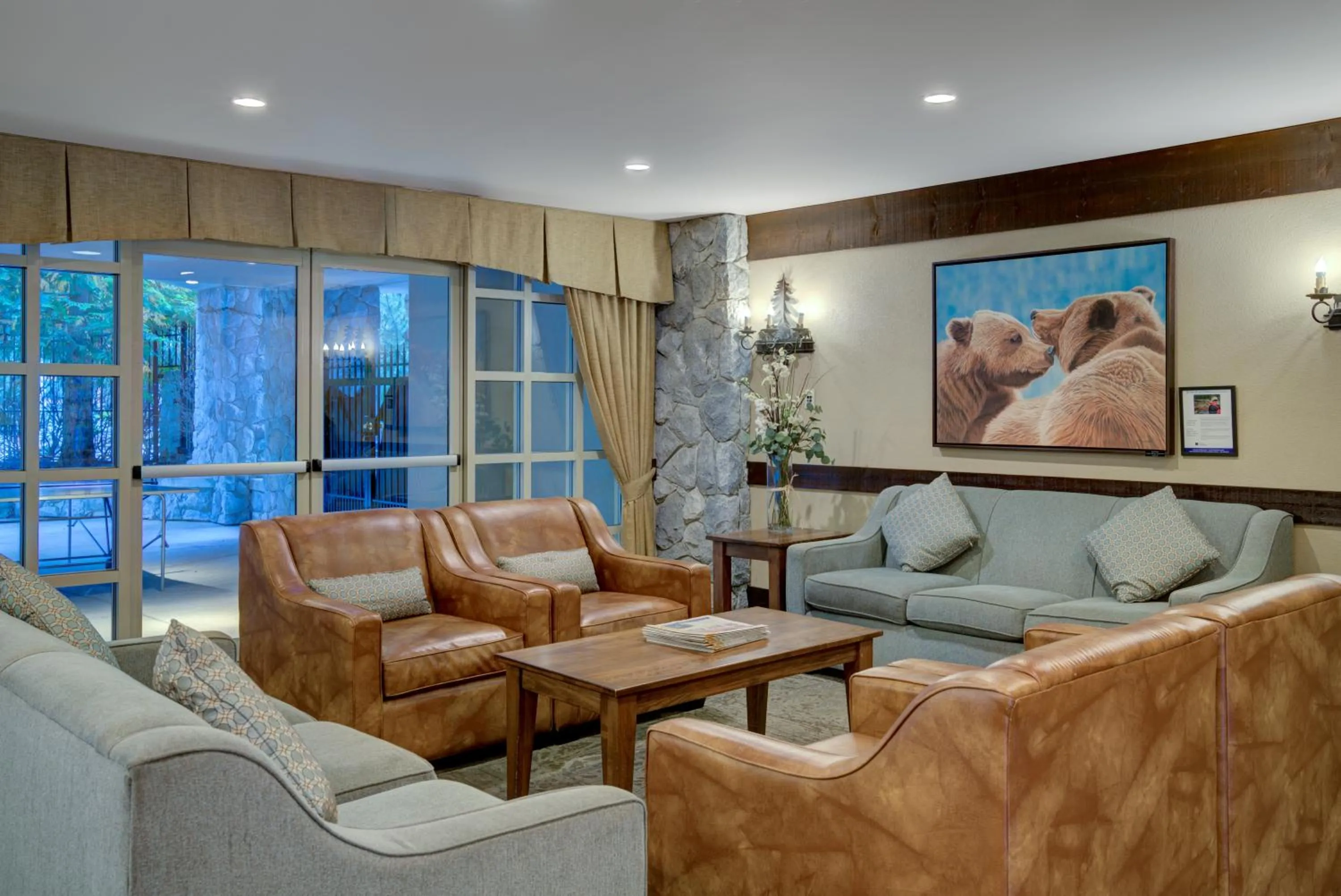 Lobby or reception in Blackcomb Springs Suites by CLIQUE