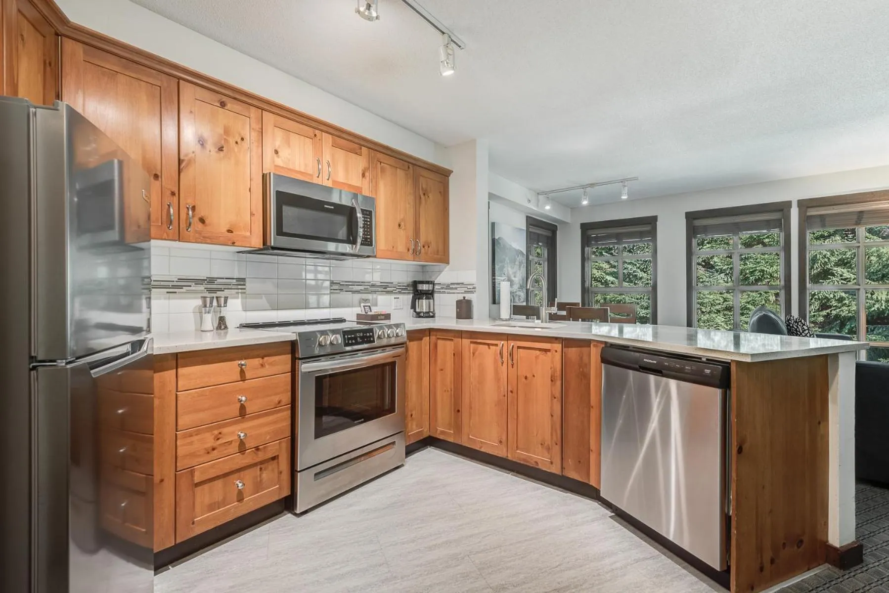 Kitchen or kitchenette in Blackcomb Springs Suites by CLIQUE