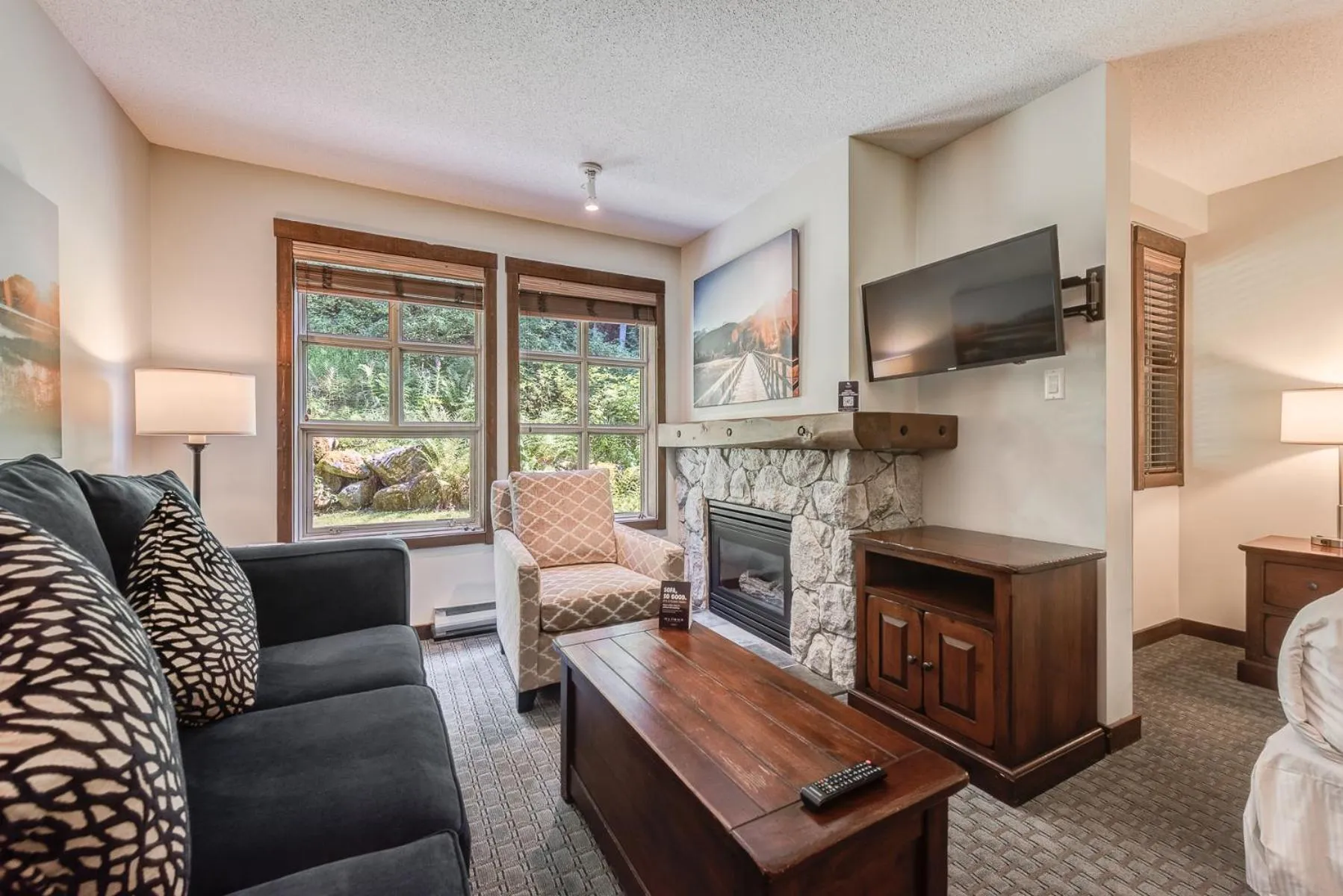 TV and multimedia in Blackcomb Springs Suites by CLIQUE