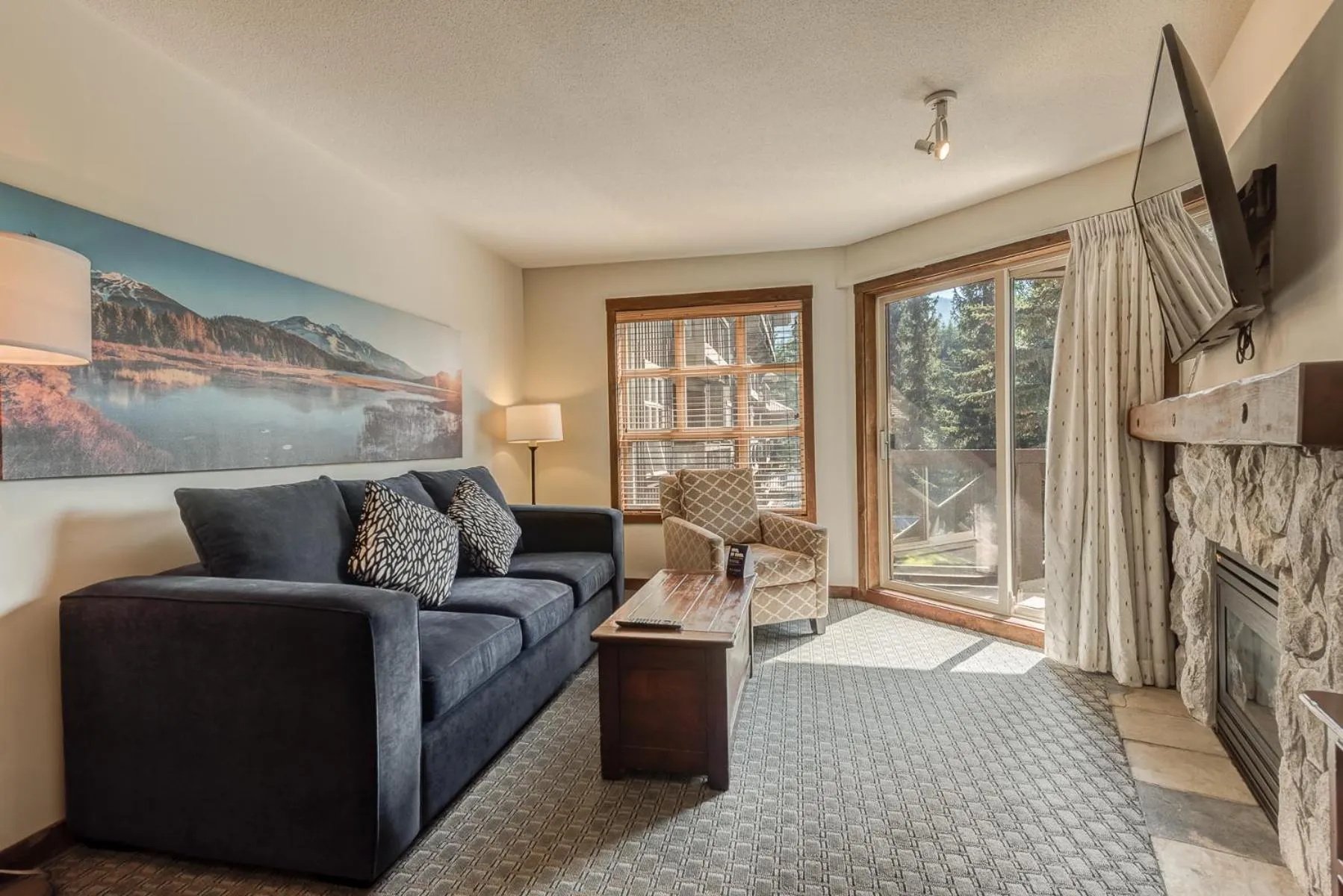 TV and multimedia in Blackcomb Springs Suites by CLIQUE