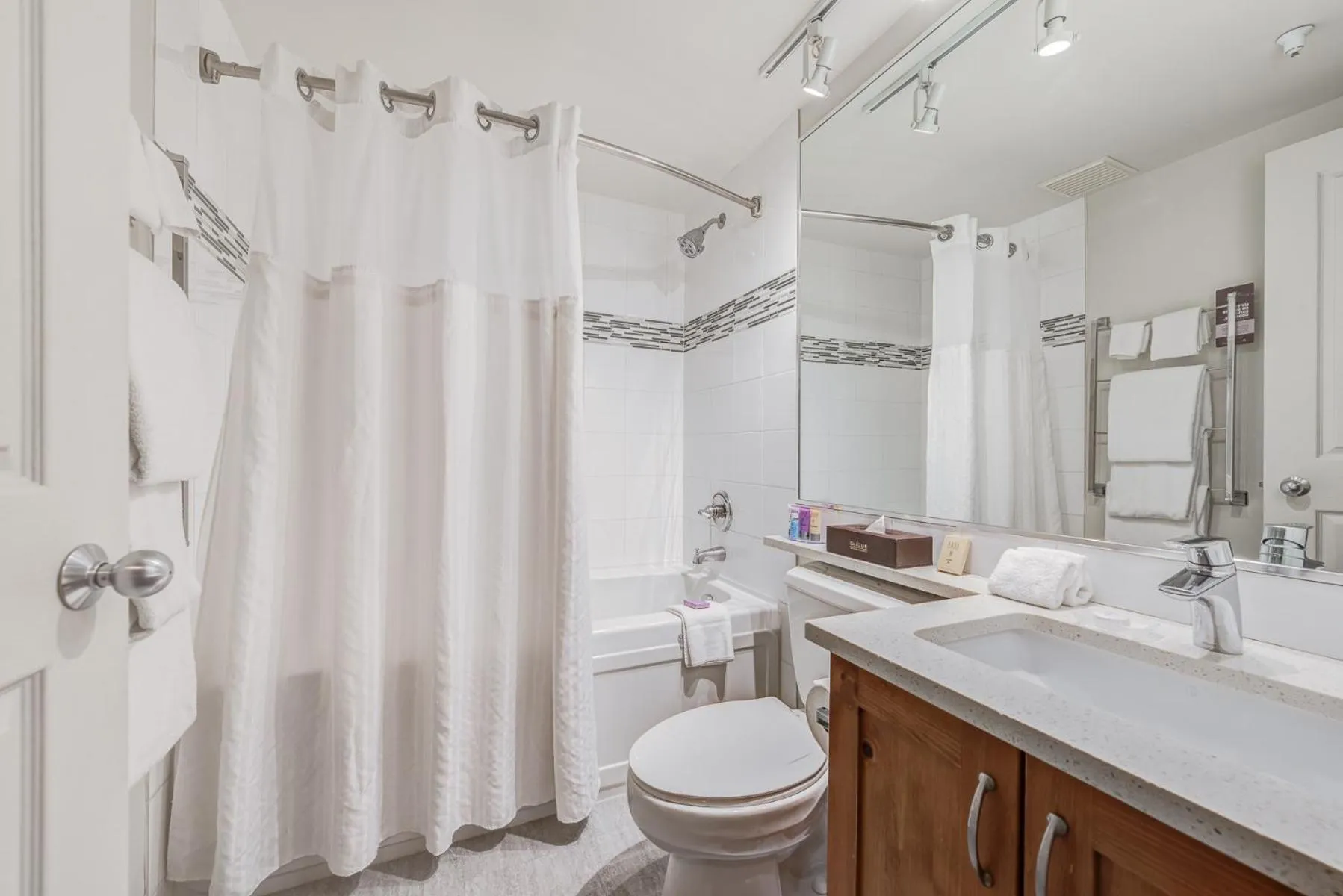 Shower in Blackcomb Springs Suites by CLIQUE