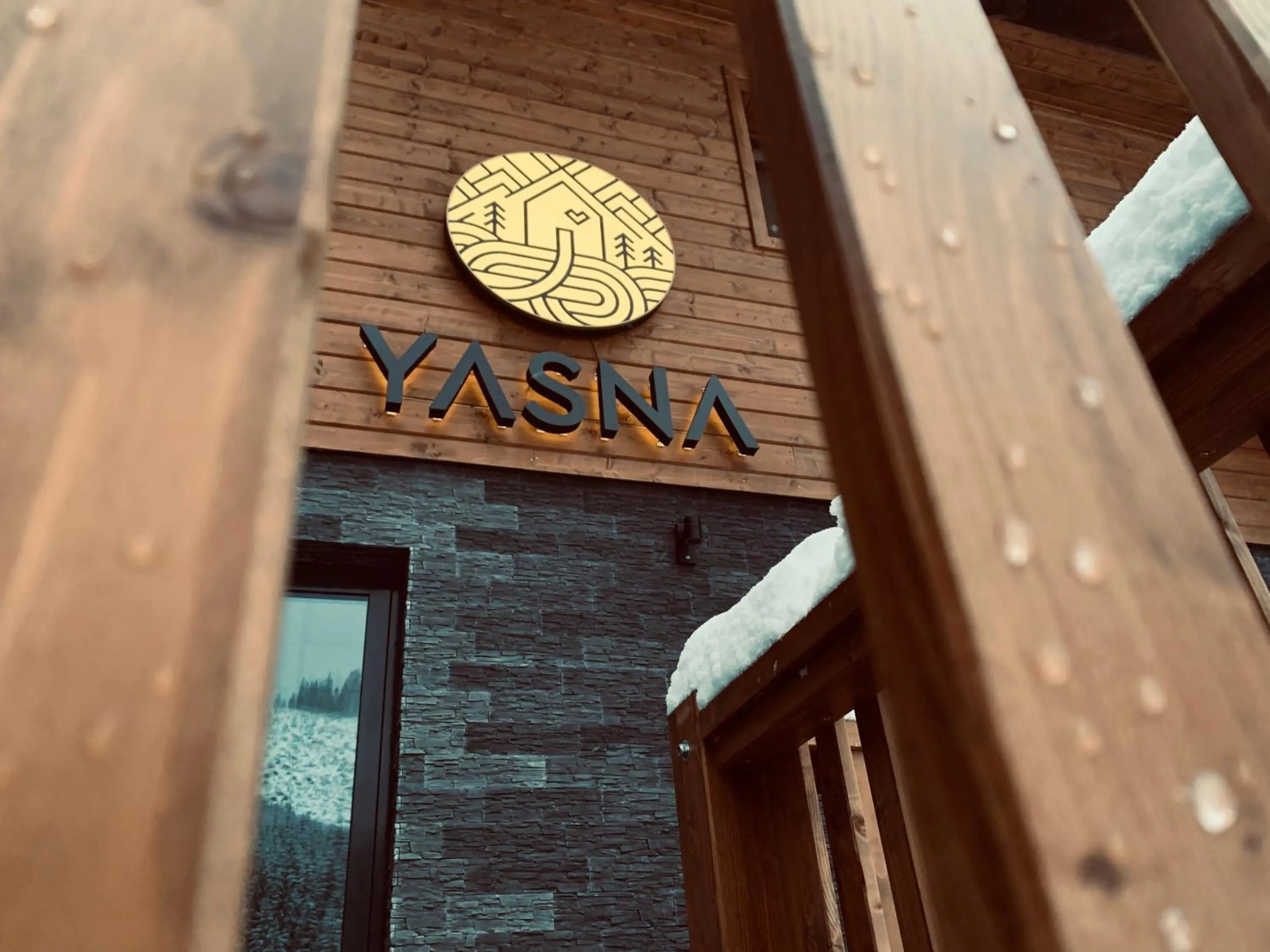 Property logo or sign in YASNA Apartments