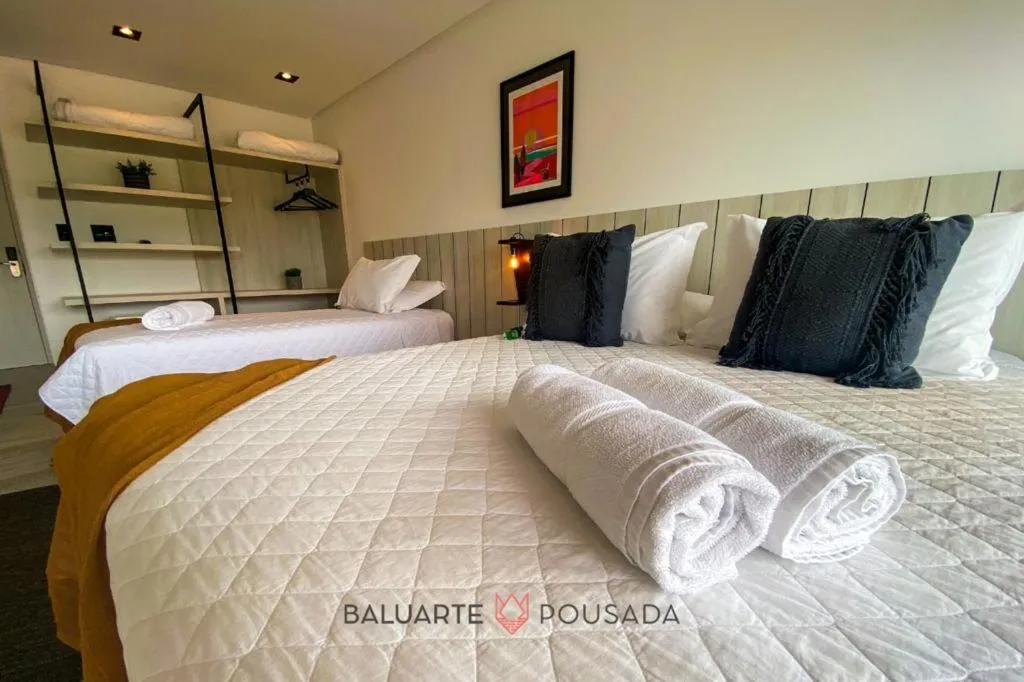 Bed in BALUARTE POUSADA