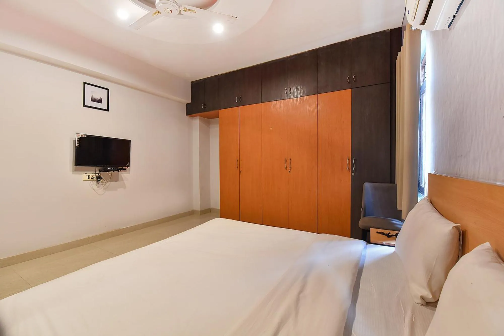 Bed in FabHotel Rushank Palace