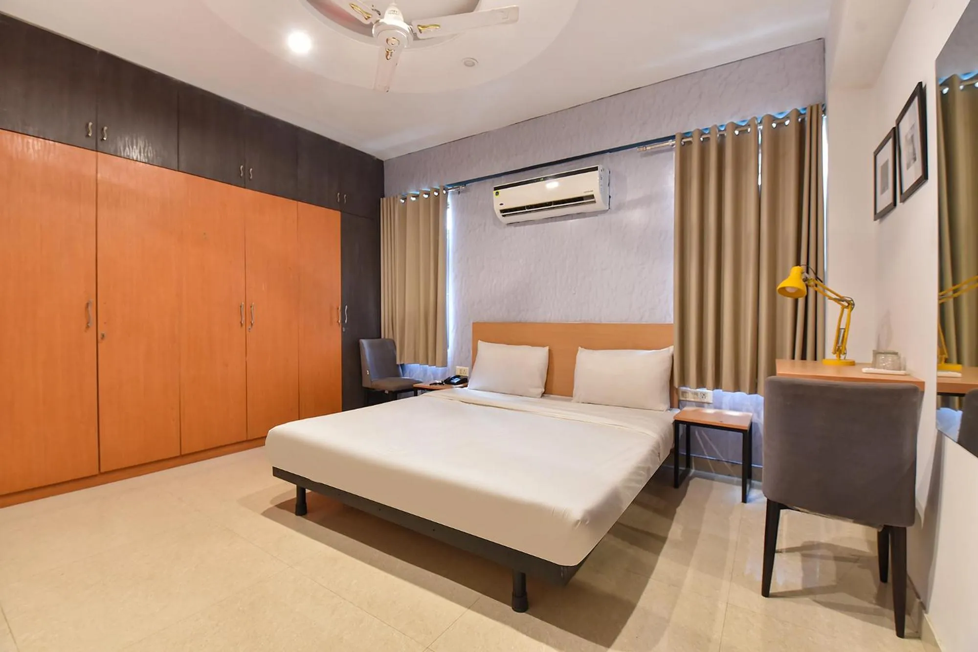 Bed in FabHotel Rushank Palace