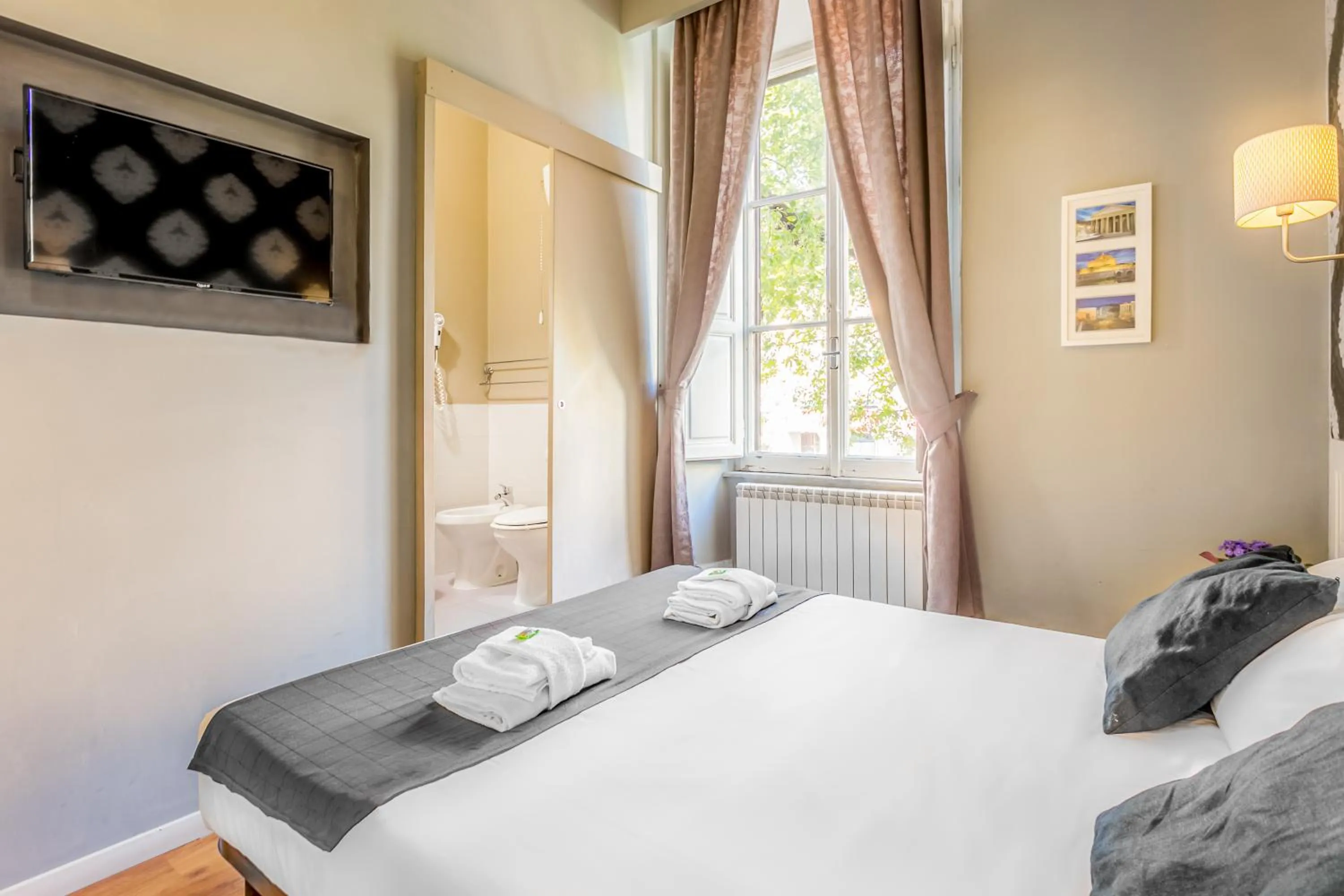 Bed in AmoRoma Suite