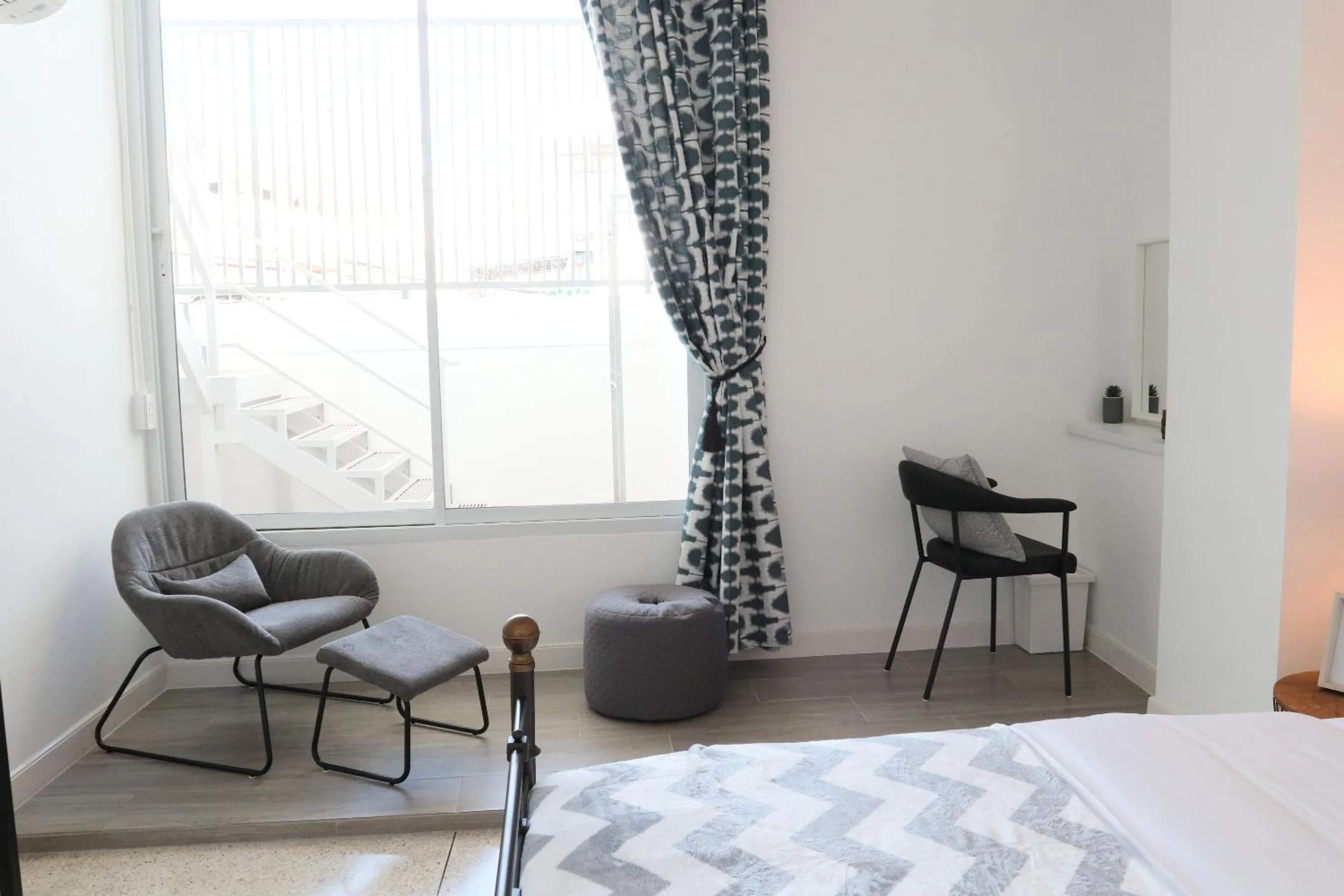 Seating area, Bed in Airee Premier Residence