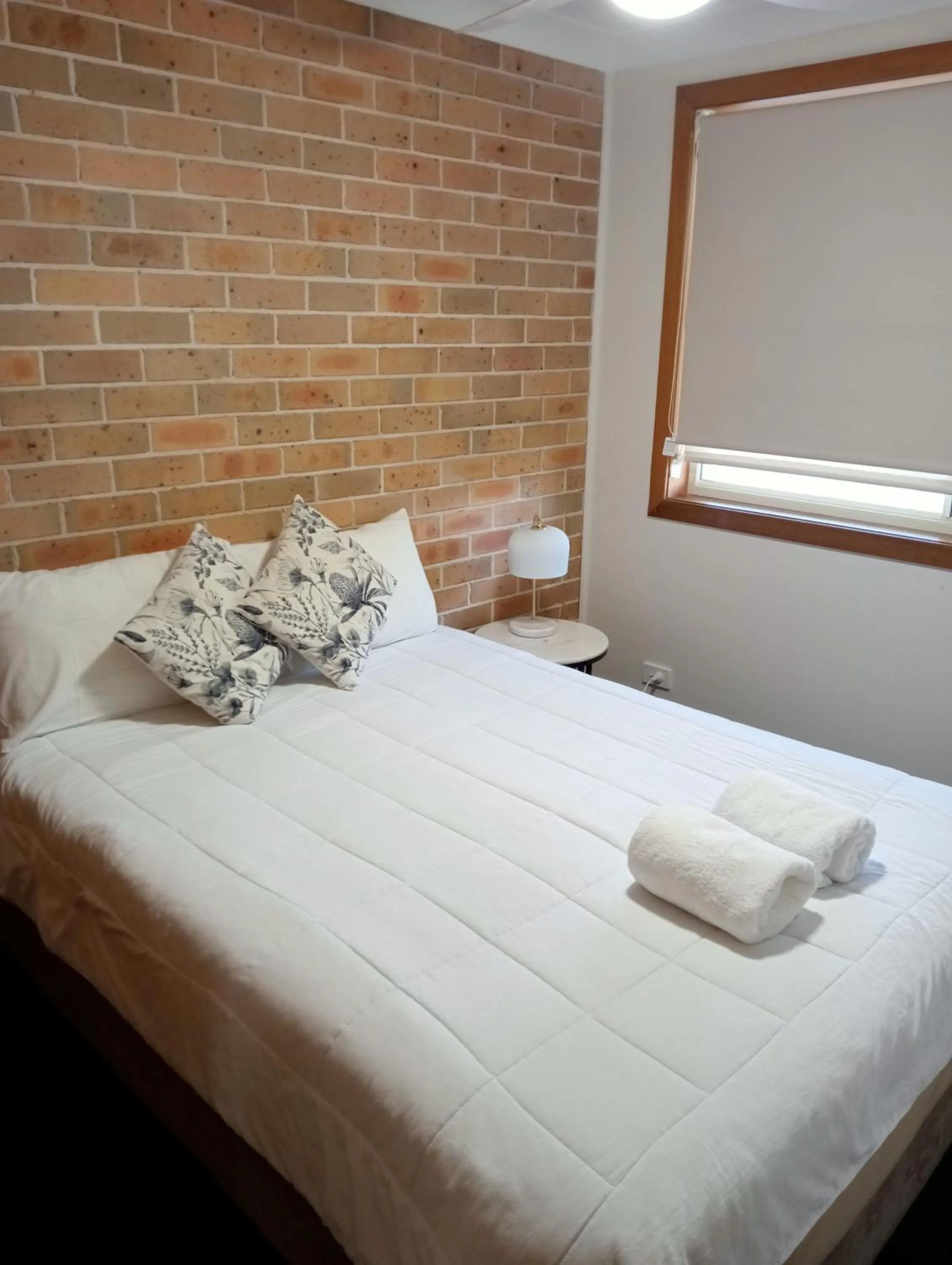 Bed in Forster Palms Motel