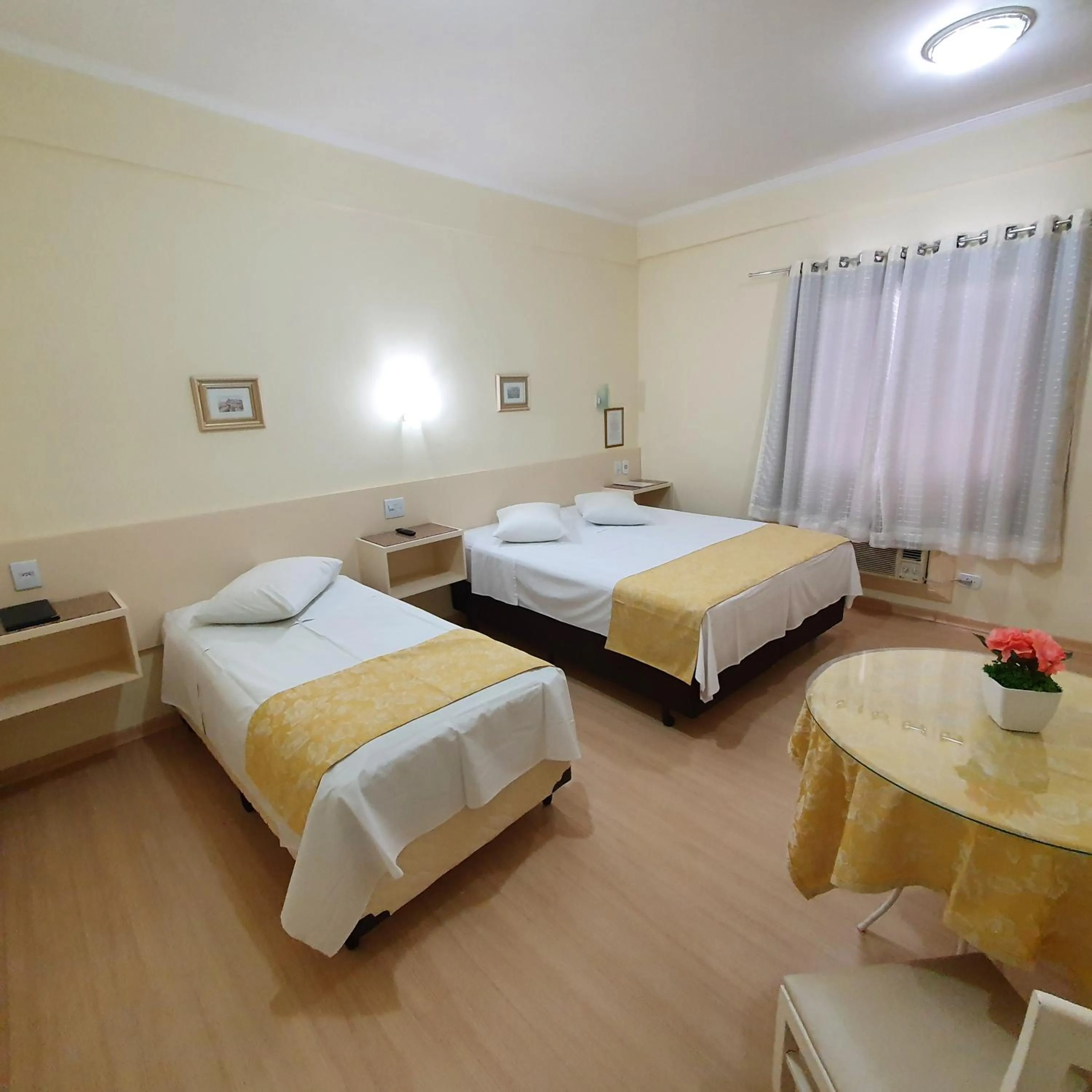 Bed in Grand Ville Hotel