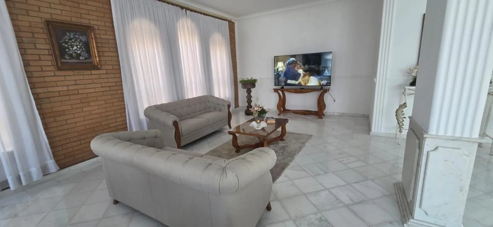 Communal lounge/ TV room in Grand Ville Hotel