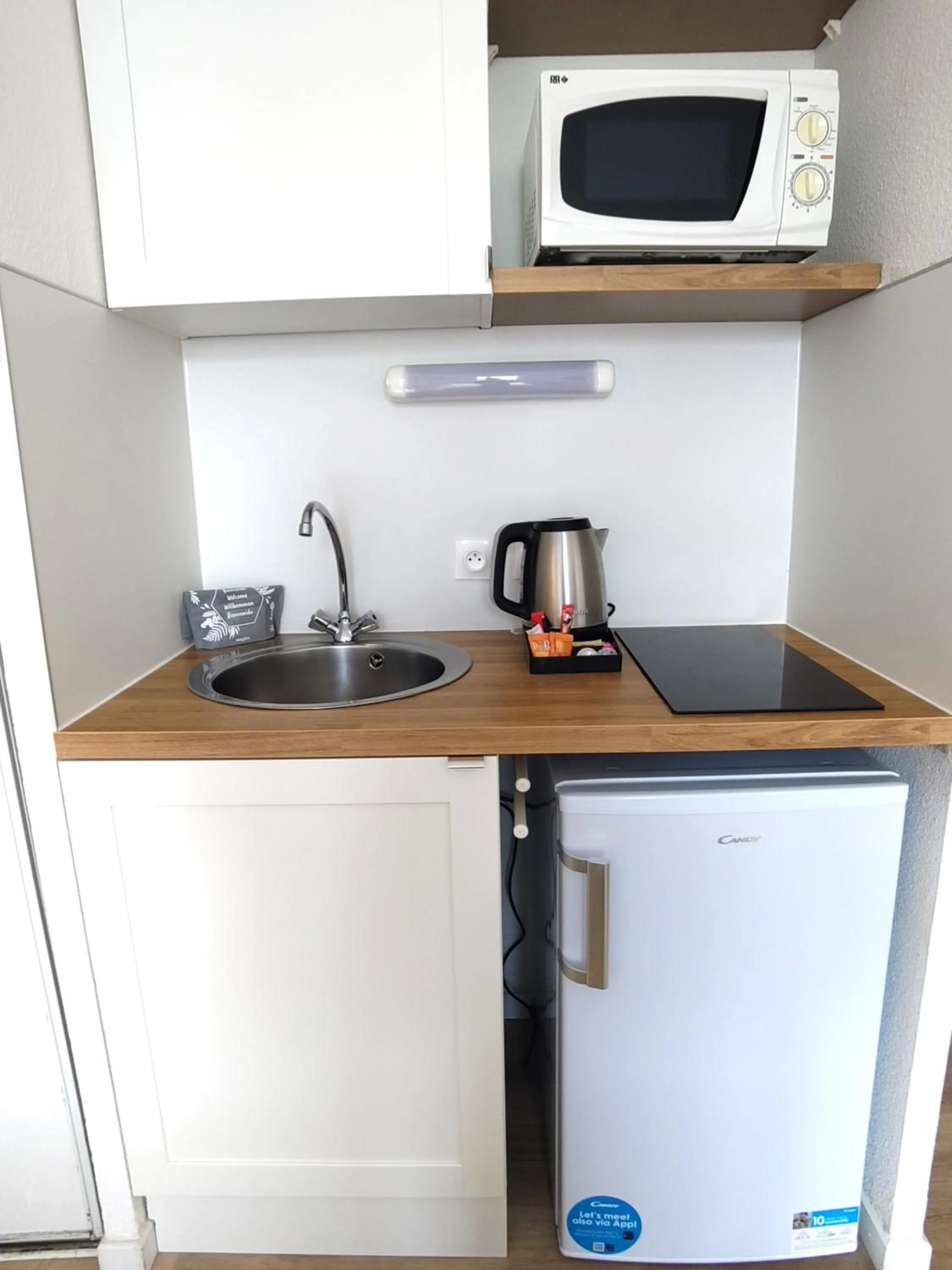 Kitchen or kitchenette in Séjours & Affaires Grenoble Marie Curie