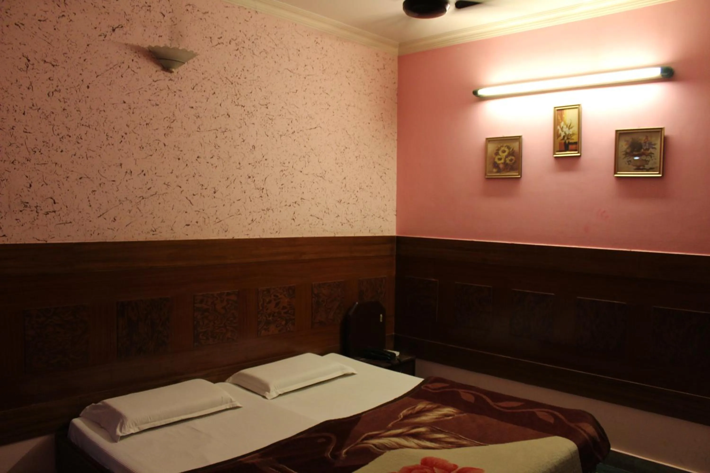 Bed in Hotel Ajay International