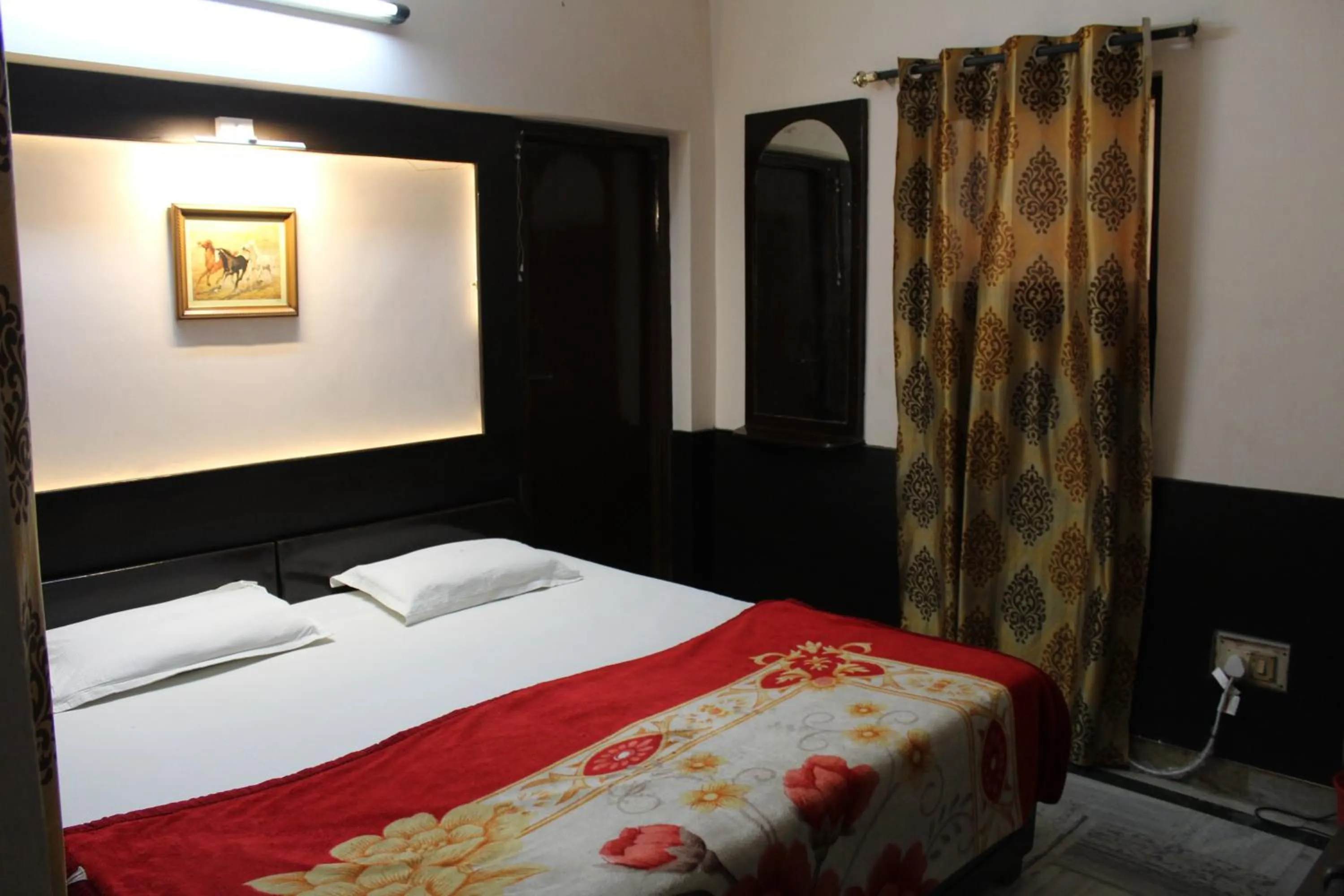 Bed in Hotel Ajay International