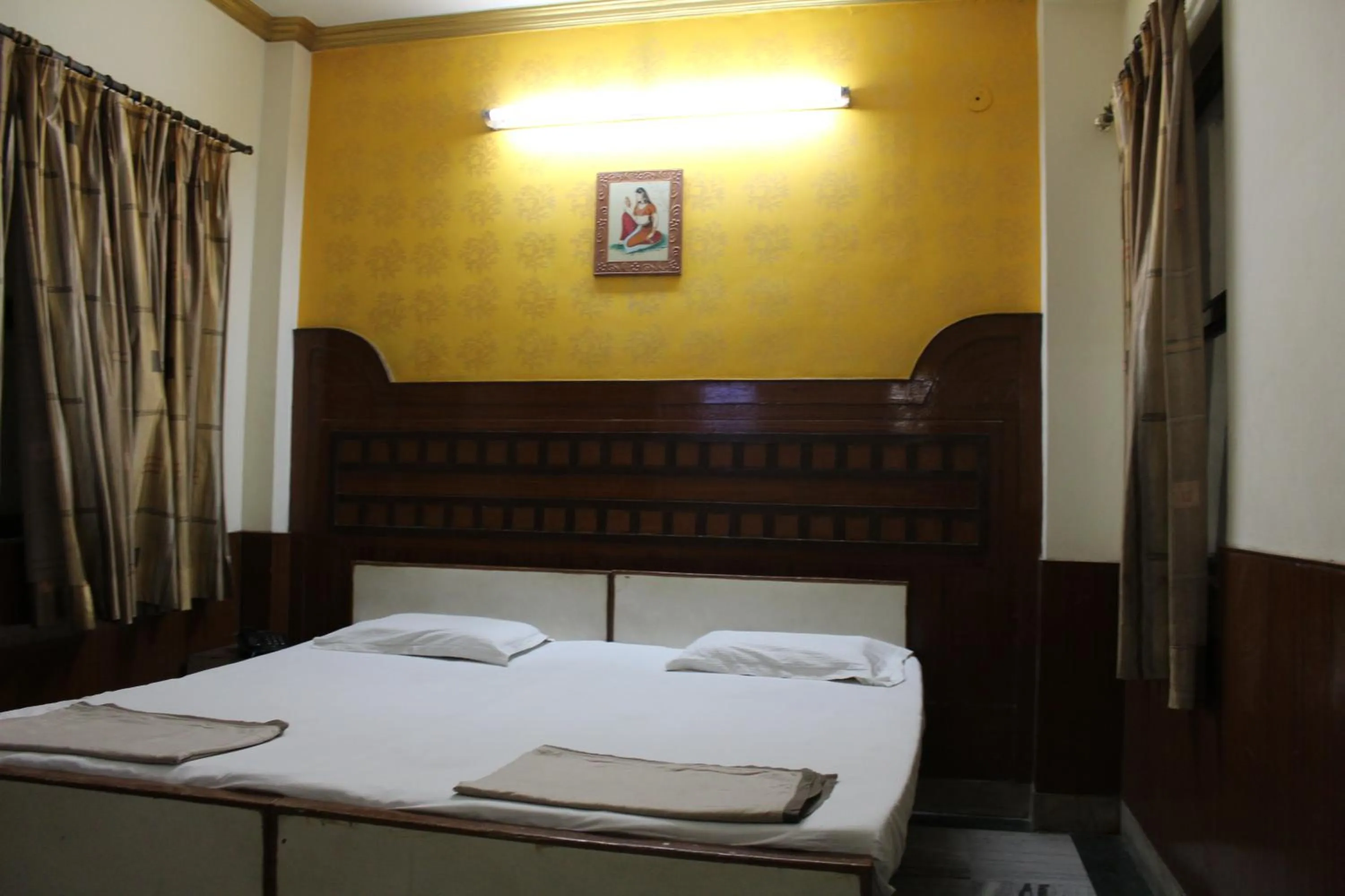 Bed in Hotel Ajay International