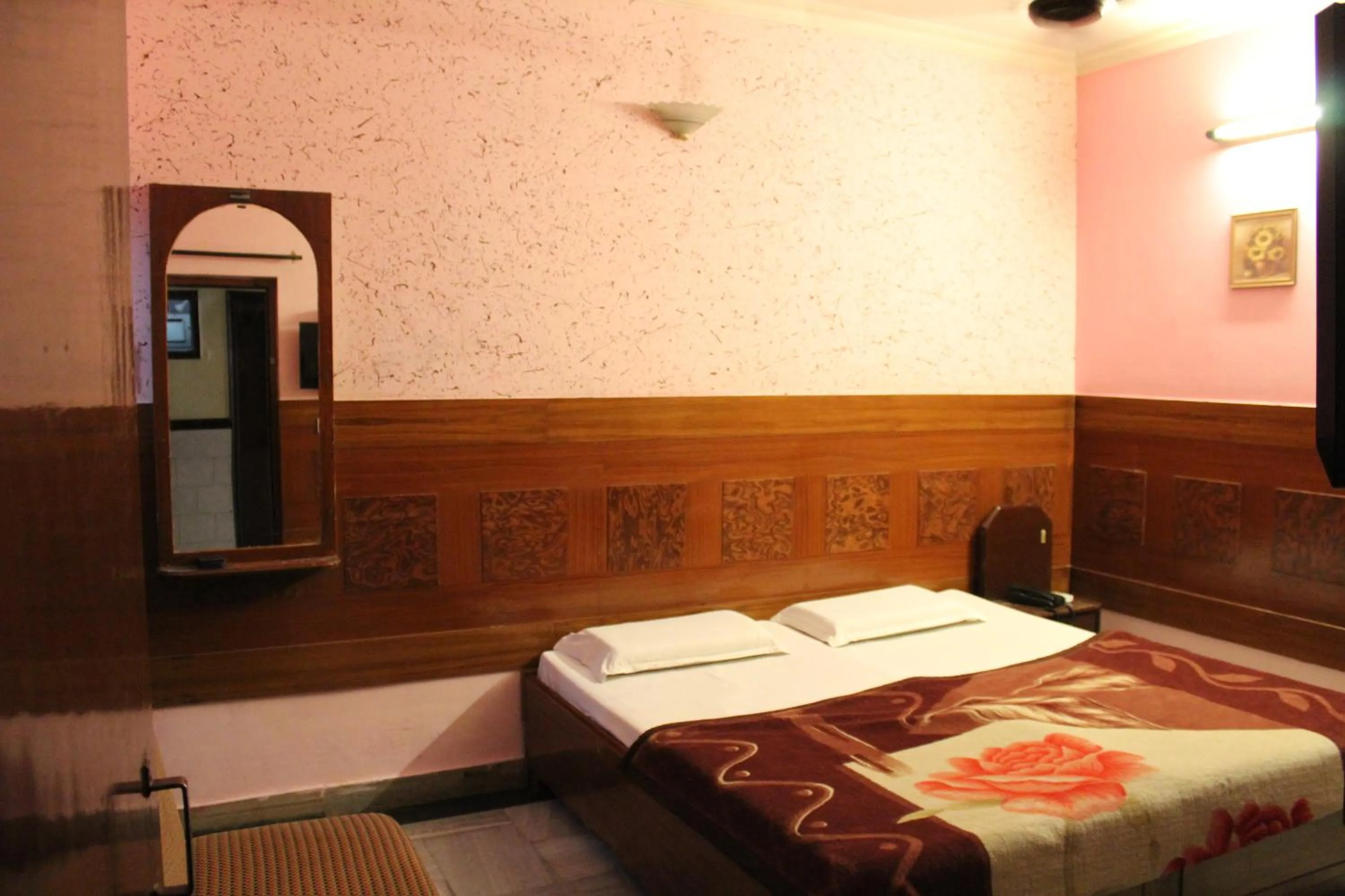 Bed in Hotel Ajay International