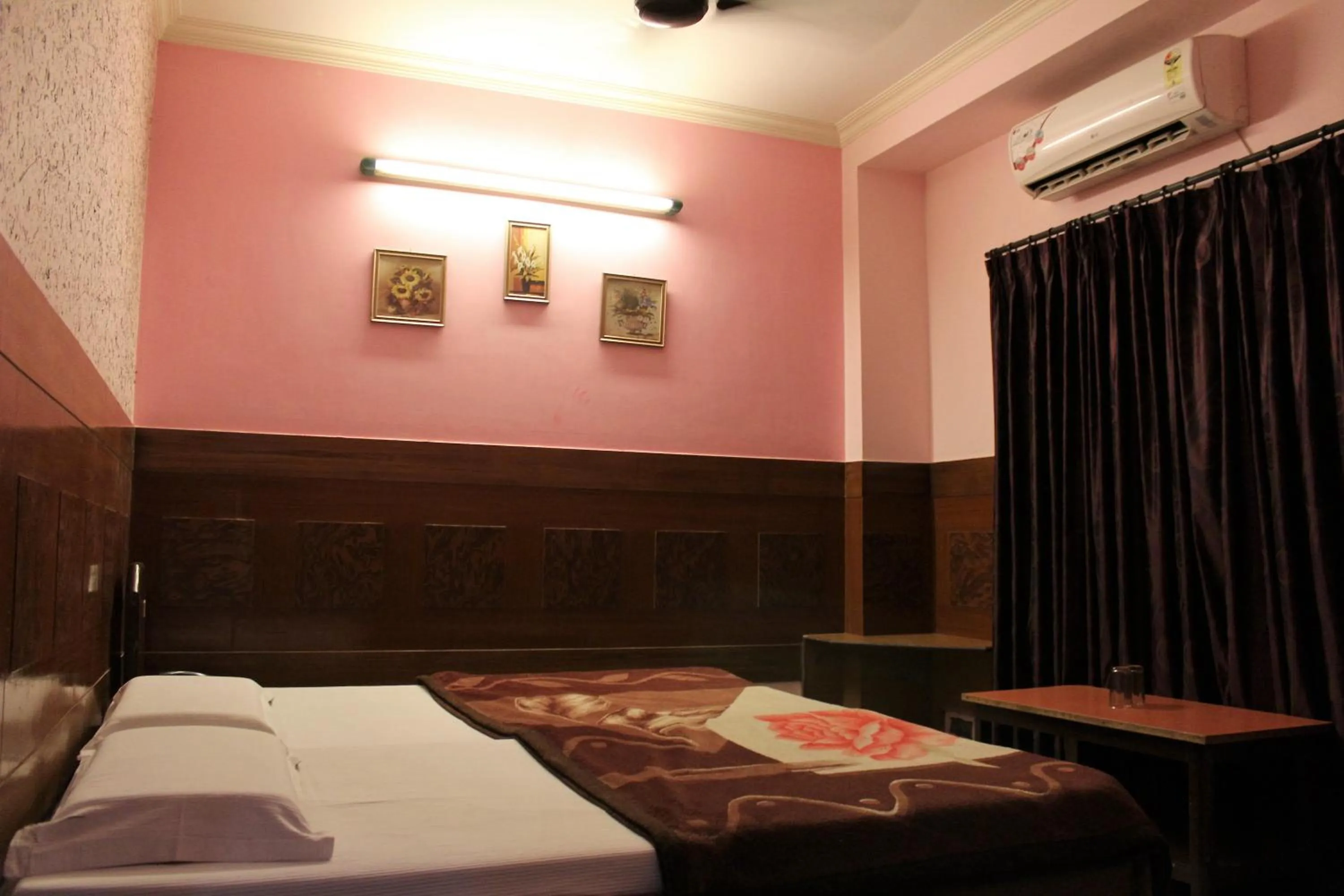 Bed in Hotel Ajay International