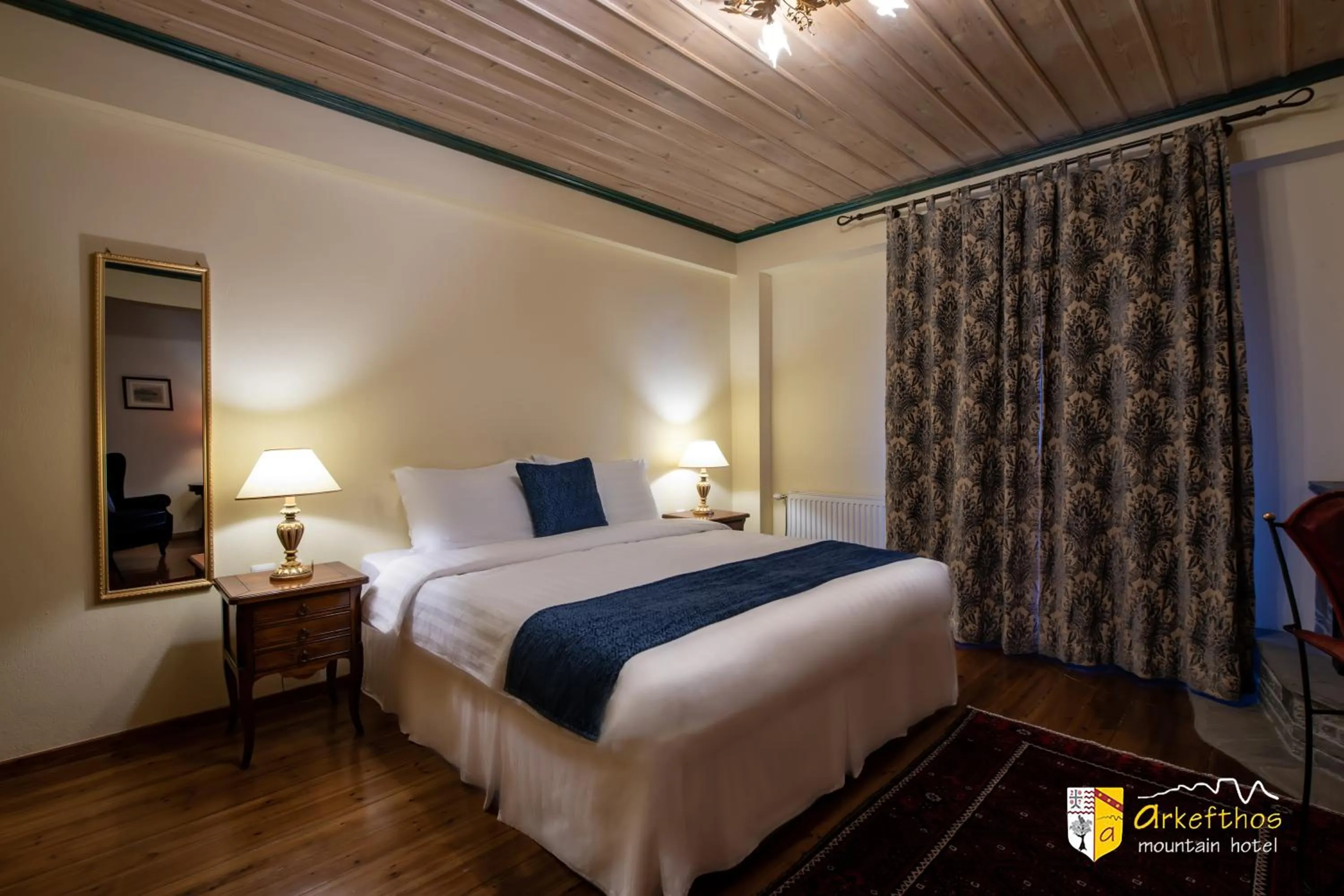 Bed in Arkefthos Mountain Hotel