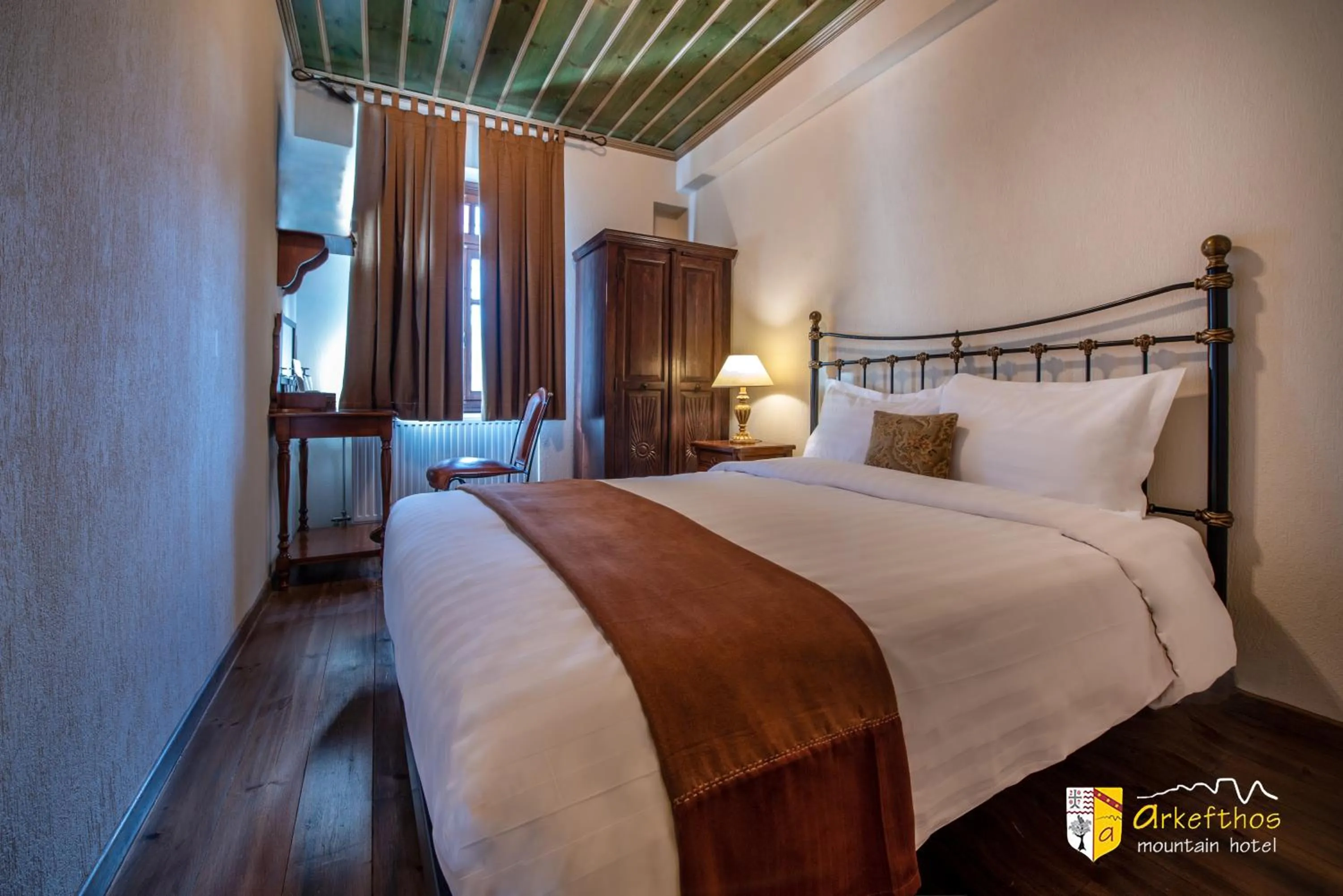 Bed in Arkefthos Mountain Hotel