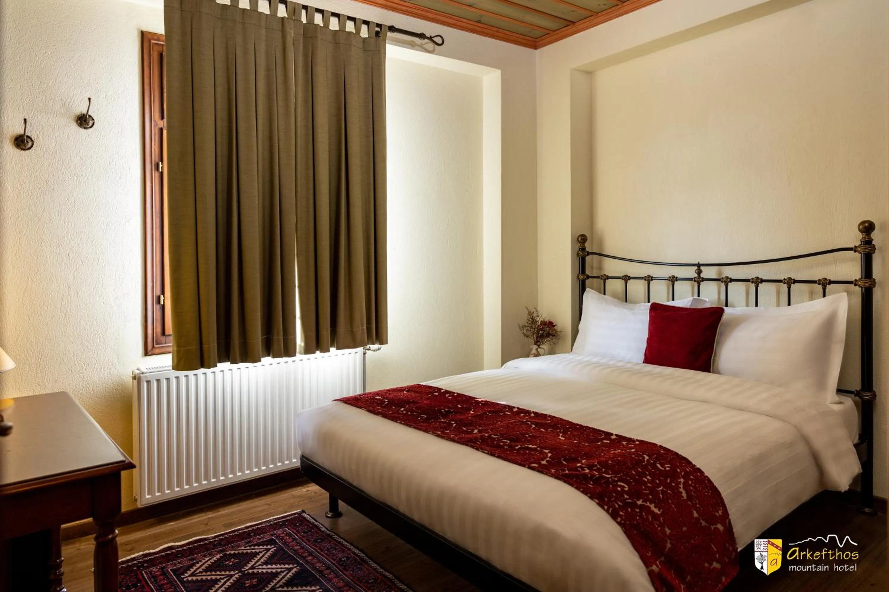 Bed in Arkefthos Mountain Hotel