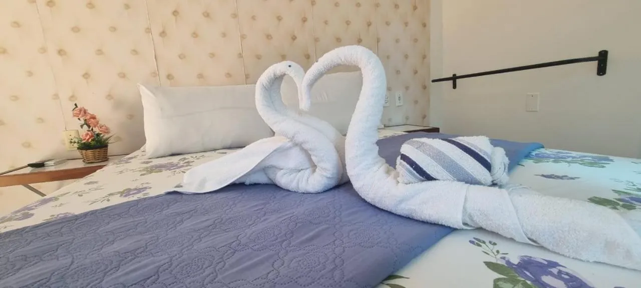 Bed in Pousada Camburi Star