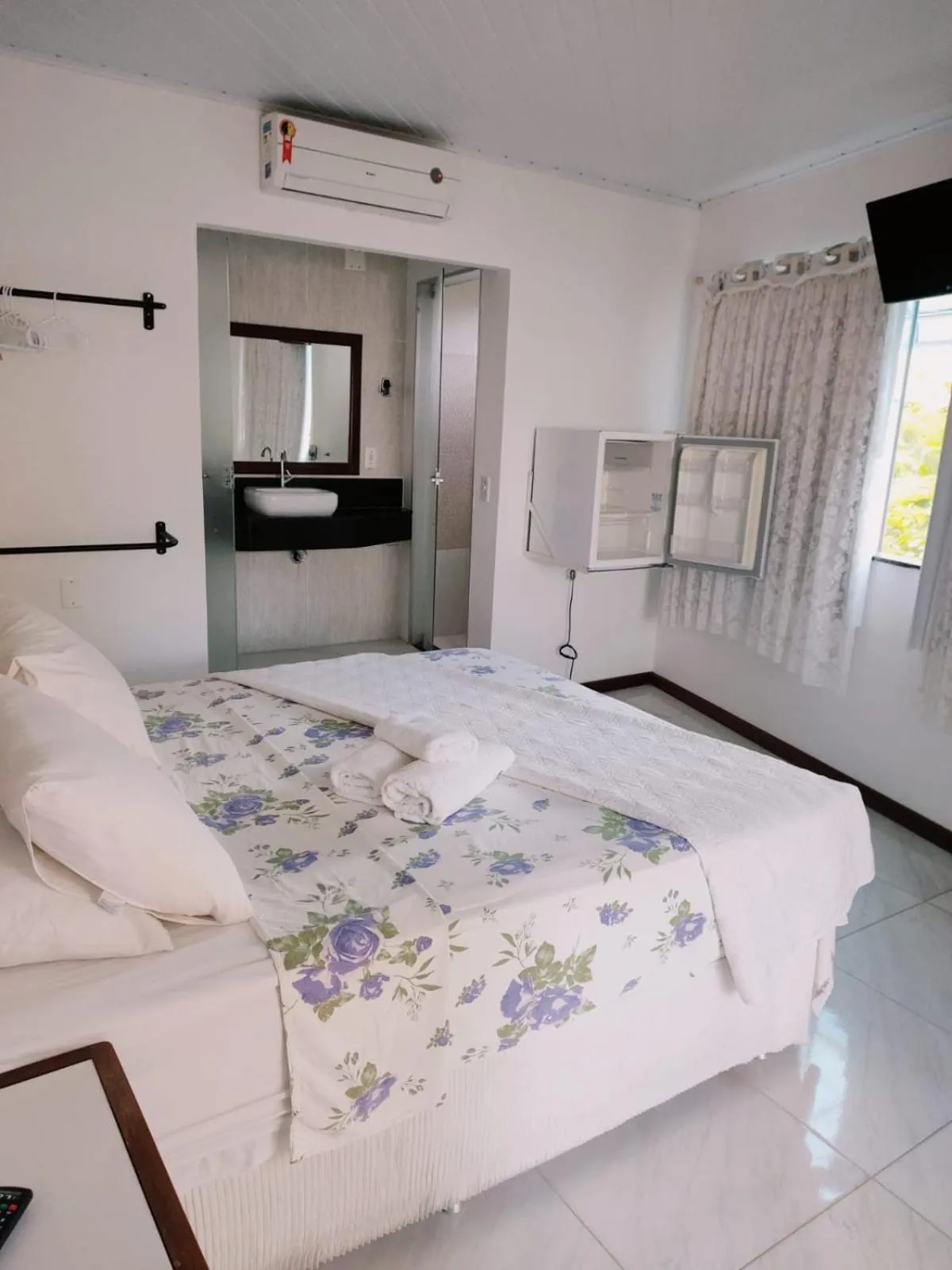 Bed in Pousada Camburi Star