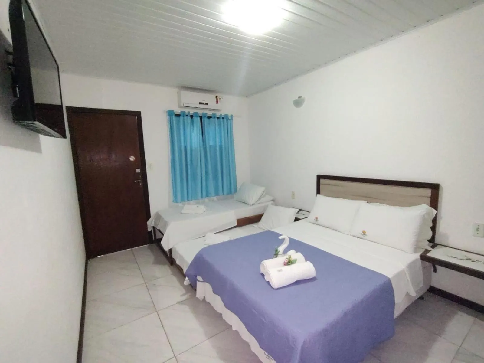 Bed in Pousada Camburi Star