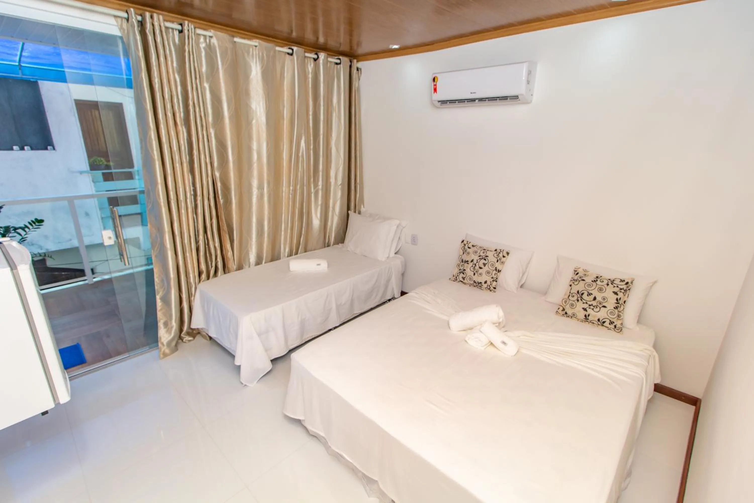 Bed in Pousada Camburi Star