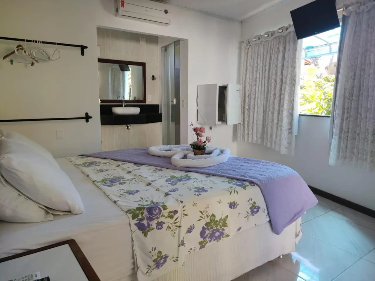 Bed in Pousada Camburi Star