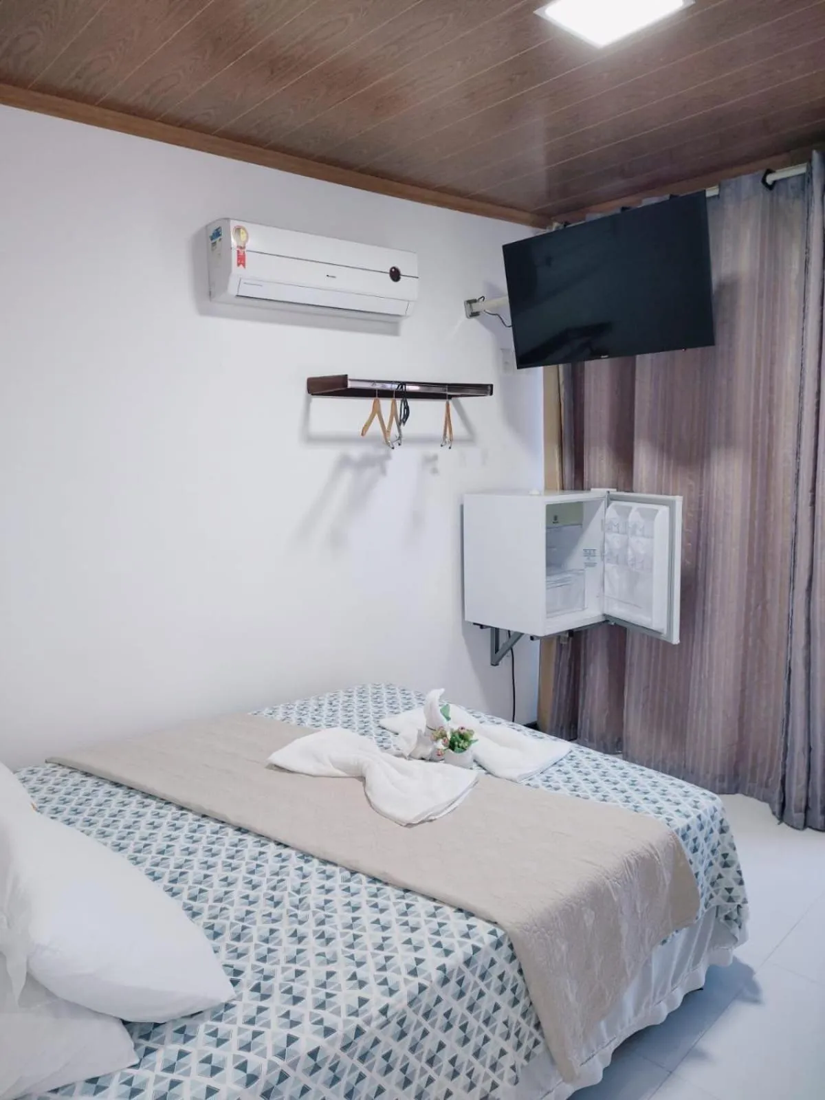 Bed in Pousada Camburi Star