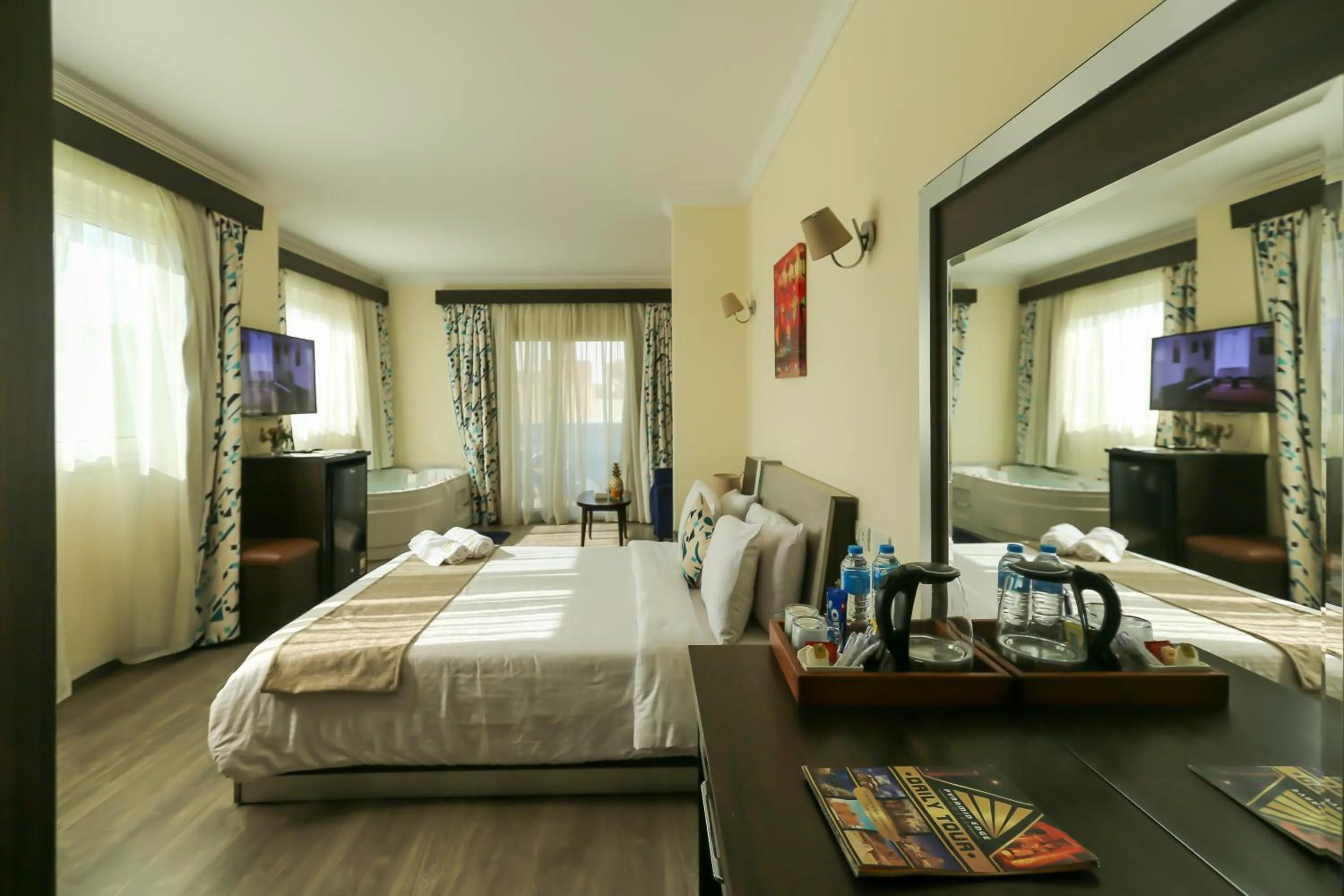 Communal lounge/ TV room, Bed in Pyramid Edge Hotel & Exclusive Pyramids View Rooftop