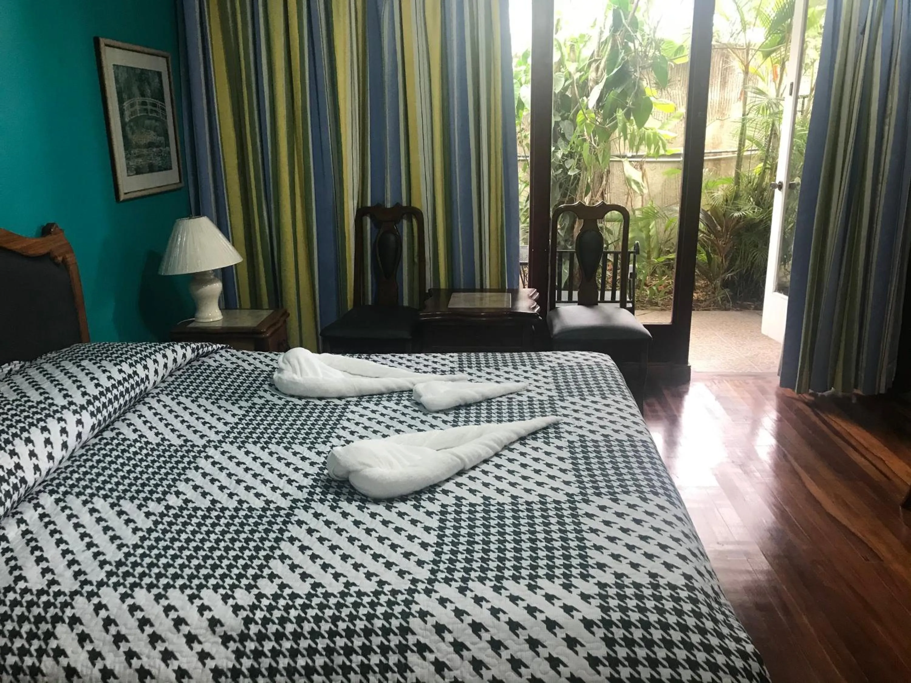 Bed in La Bergerac Boutique Hotel