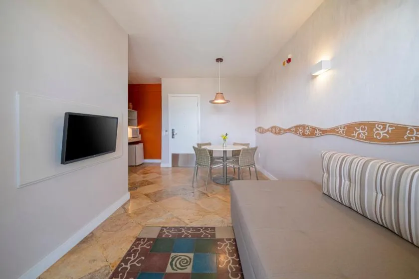 Living room, Bed in Beach Park Resort - Suites