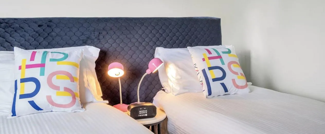 Bed in Roomie Apartment Hotel