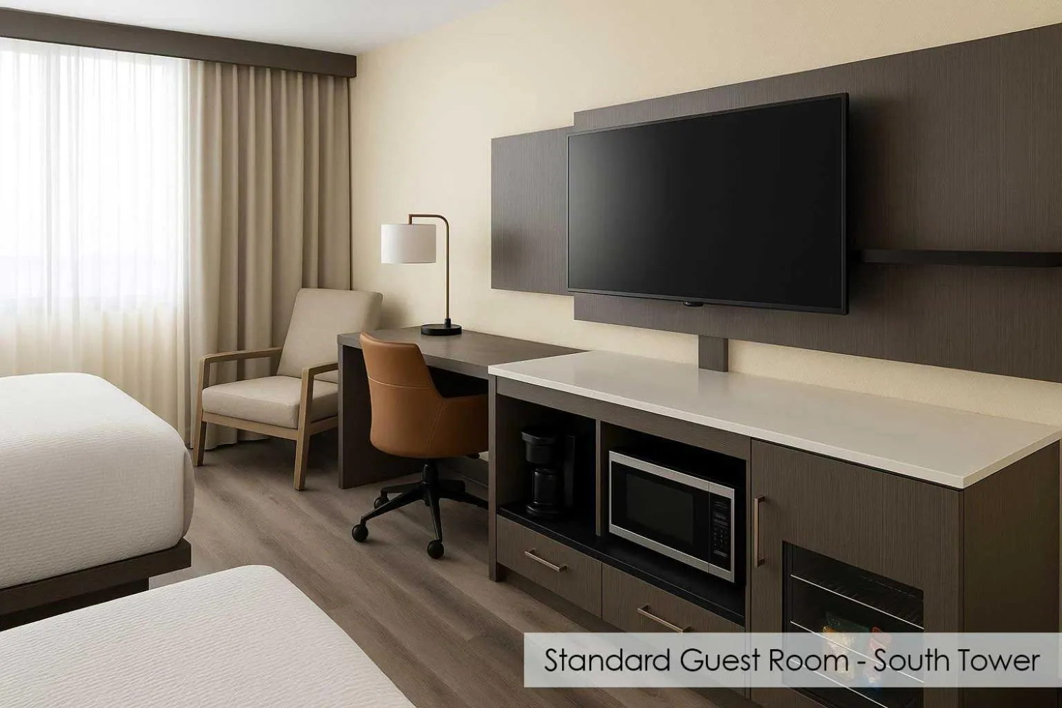 Living room, Bed in Ramada Plaza by Wyndham Orlando Resort & Suites Intl Drive - Newly Renovated!
