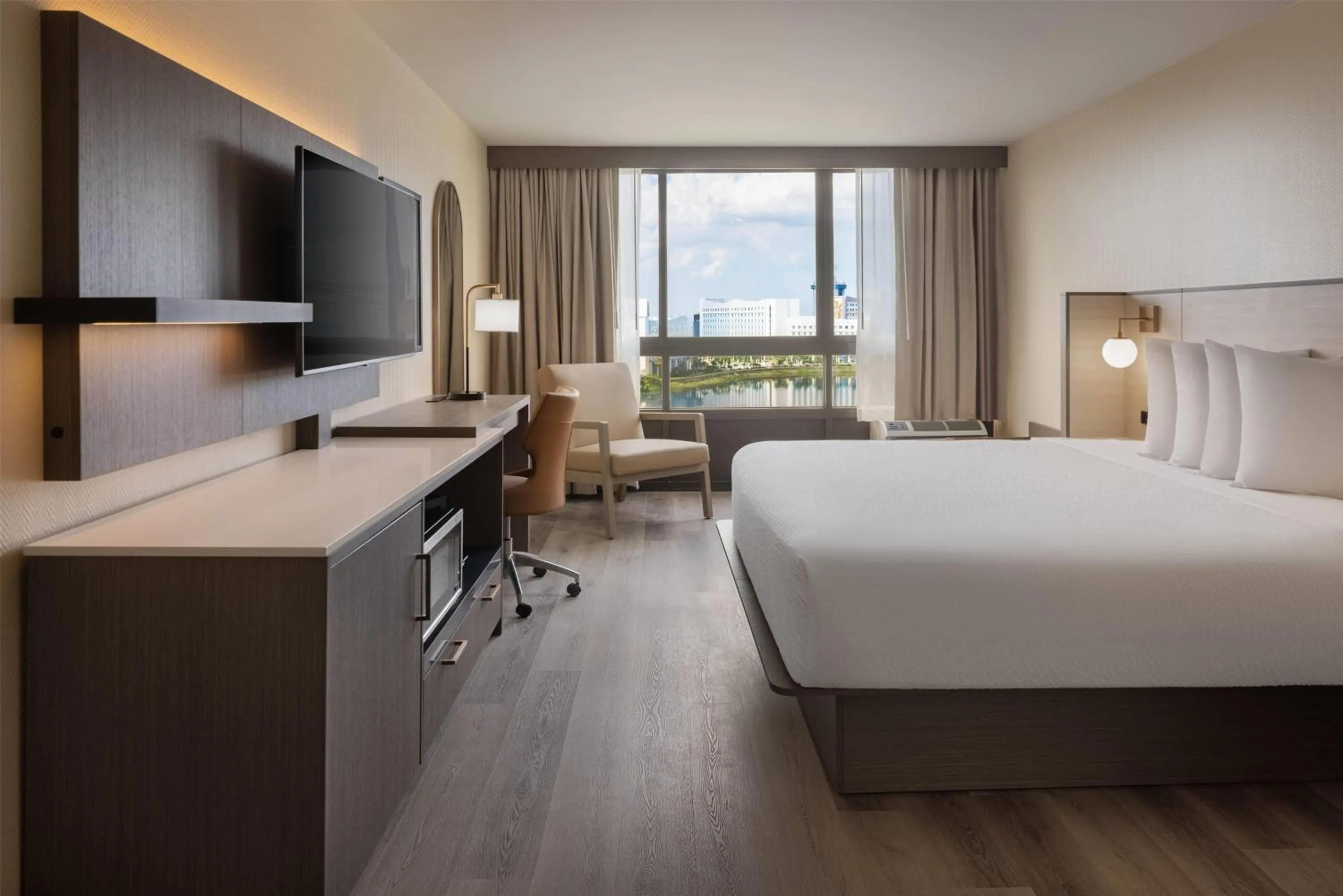 Photo of the whole room, Bed in Ramada Plaza by Wyndham Orlando Resort & Suites Intl Drive - Newly Renovated!