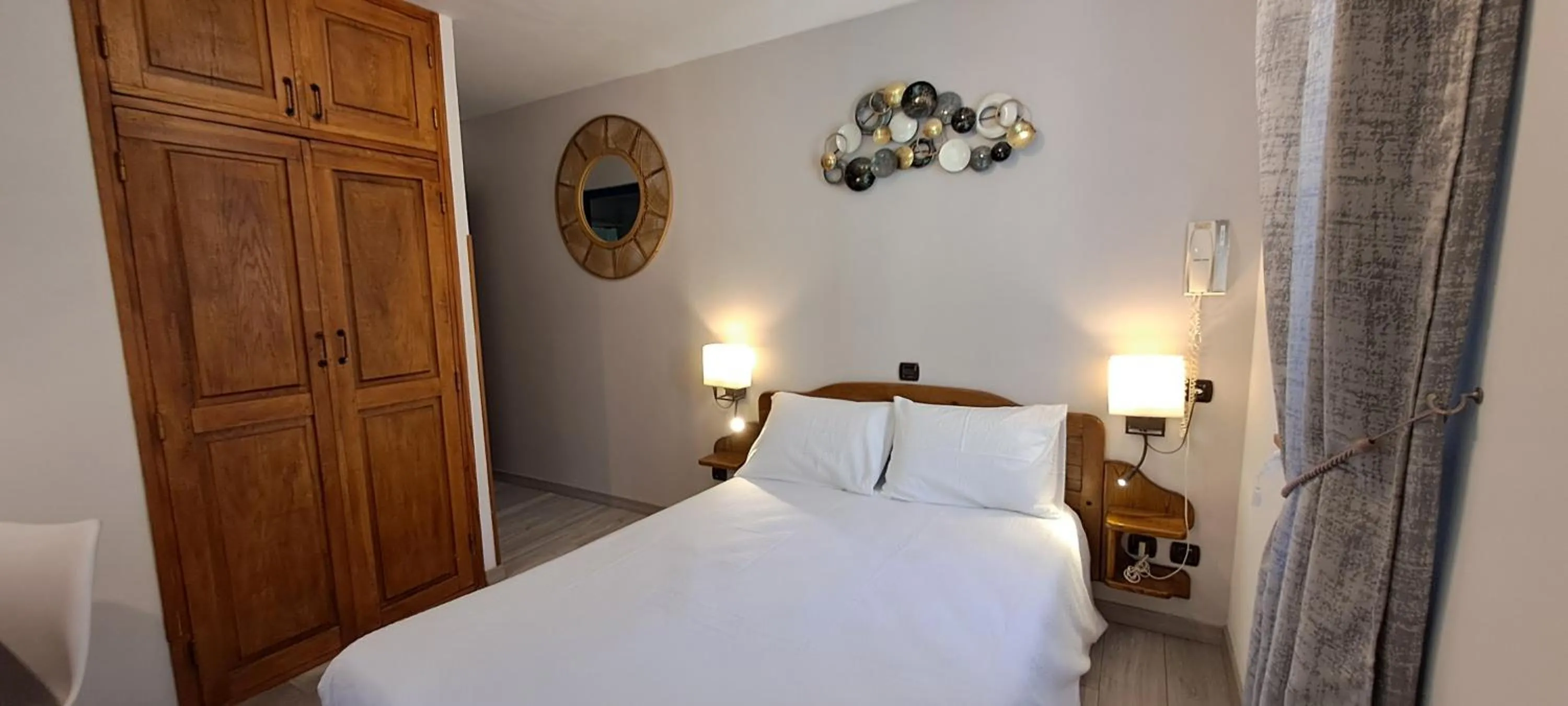 Bedroom, Bed in Logis Hôtel restaurant Auberge de la Cascade