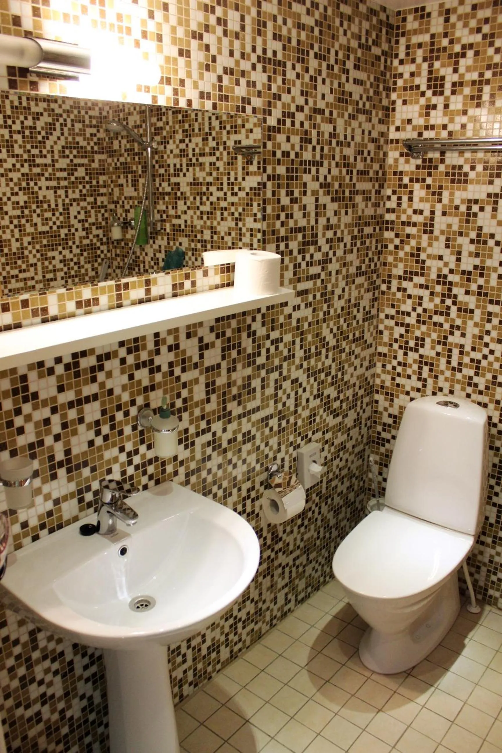 Bathroom in Embrace Hotel & Apartments