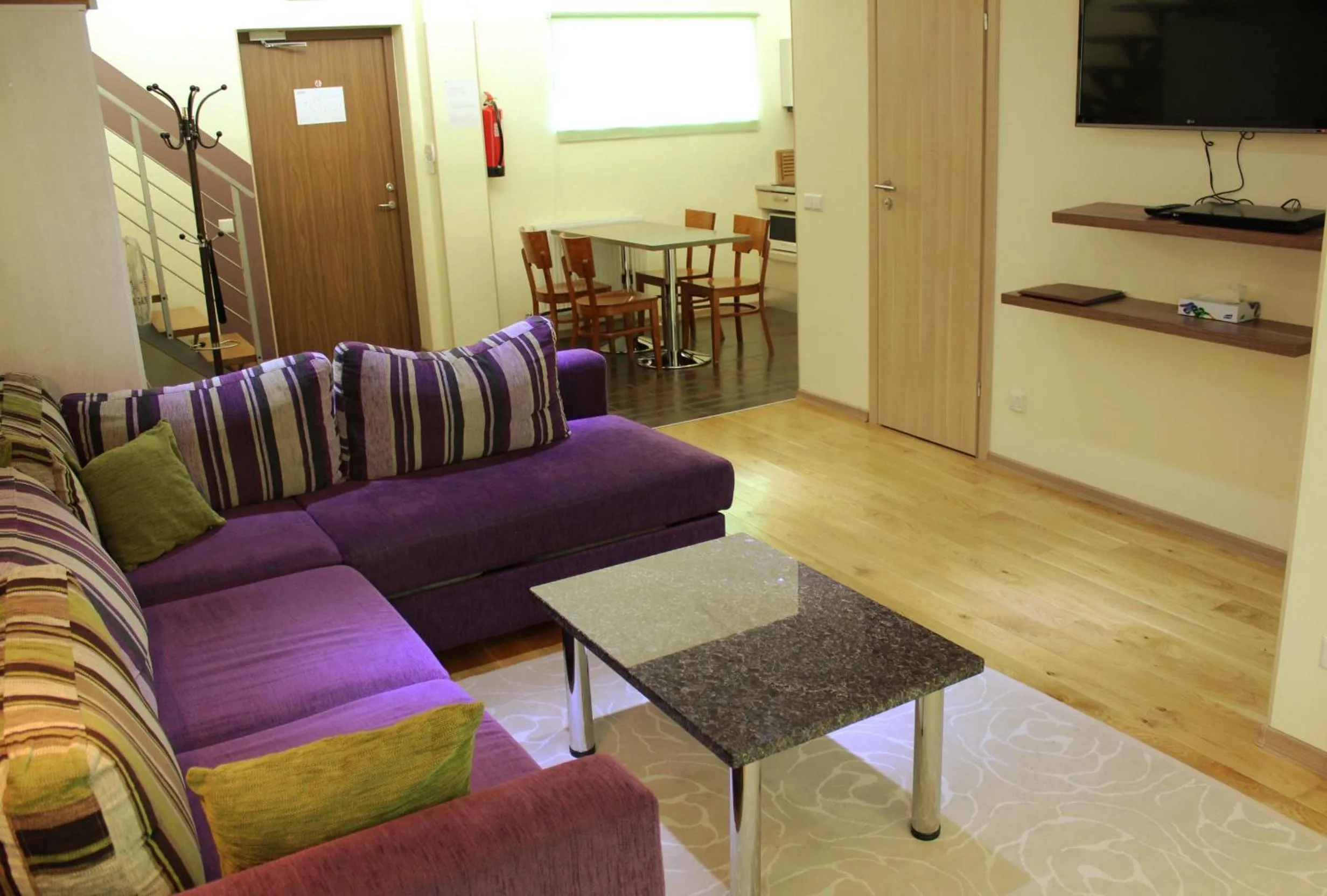 Living room in Embrace Hotel & Apartments