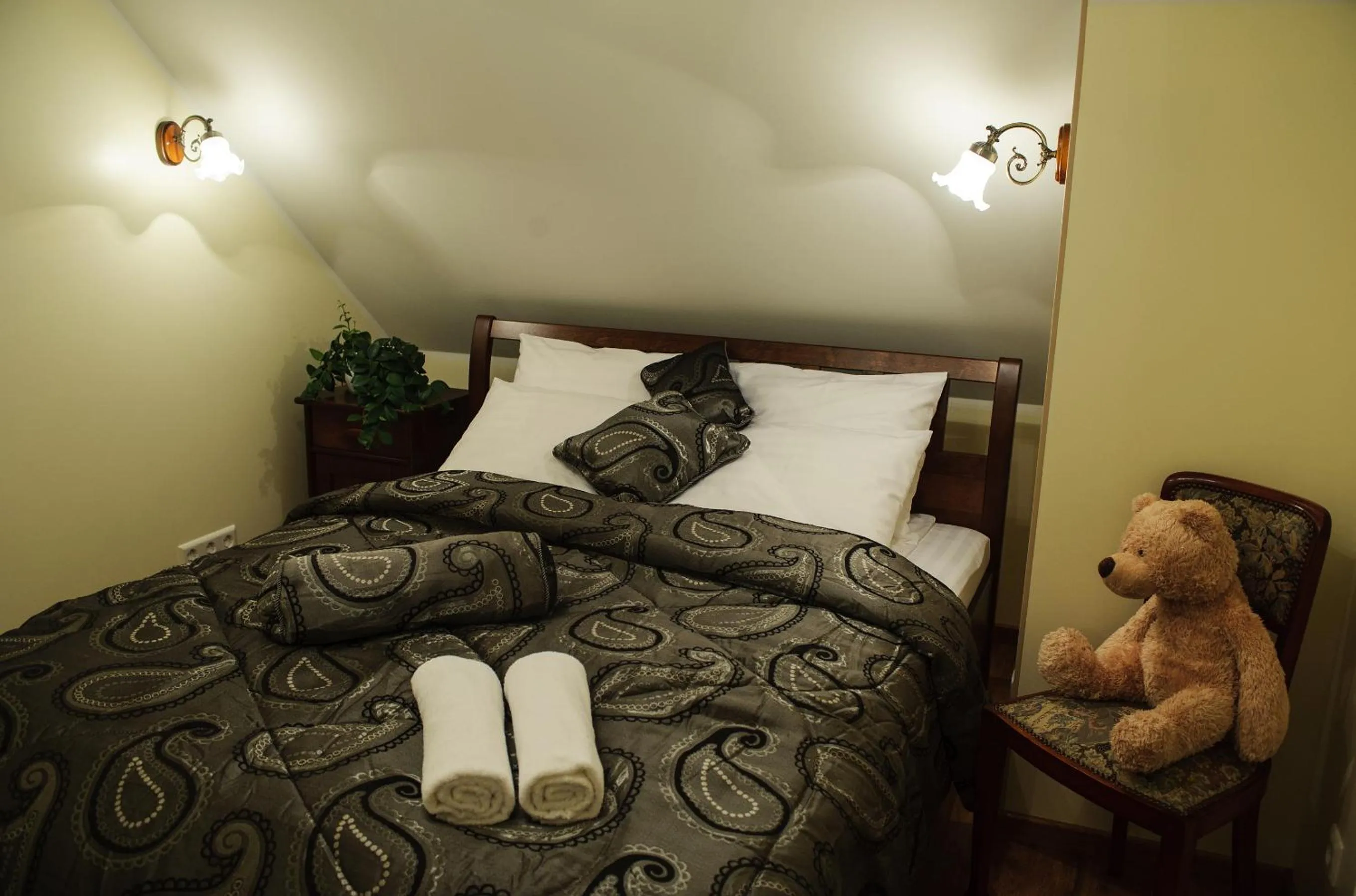 Bed in Embrace Hotel & Apartments