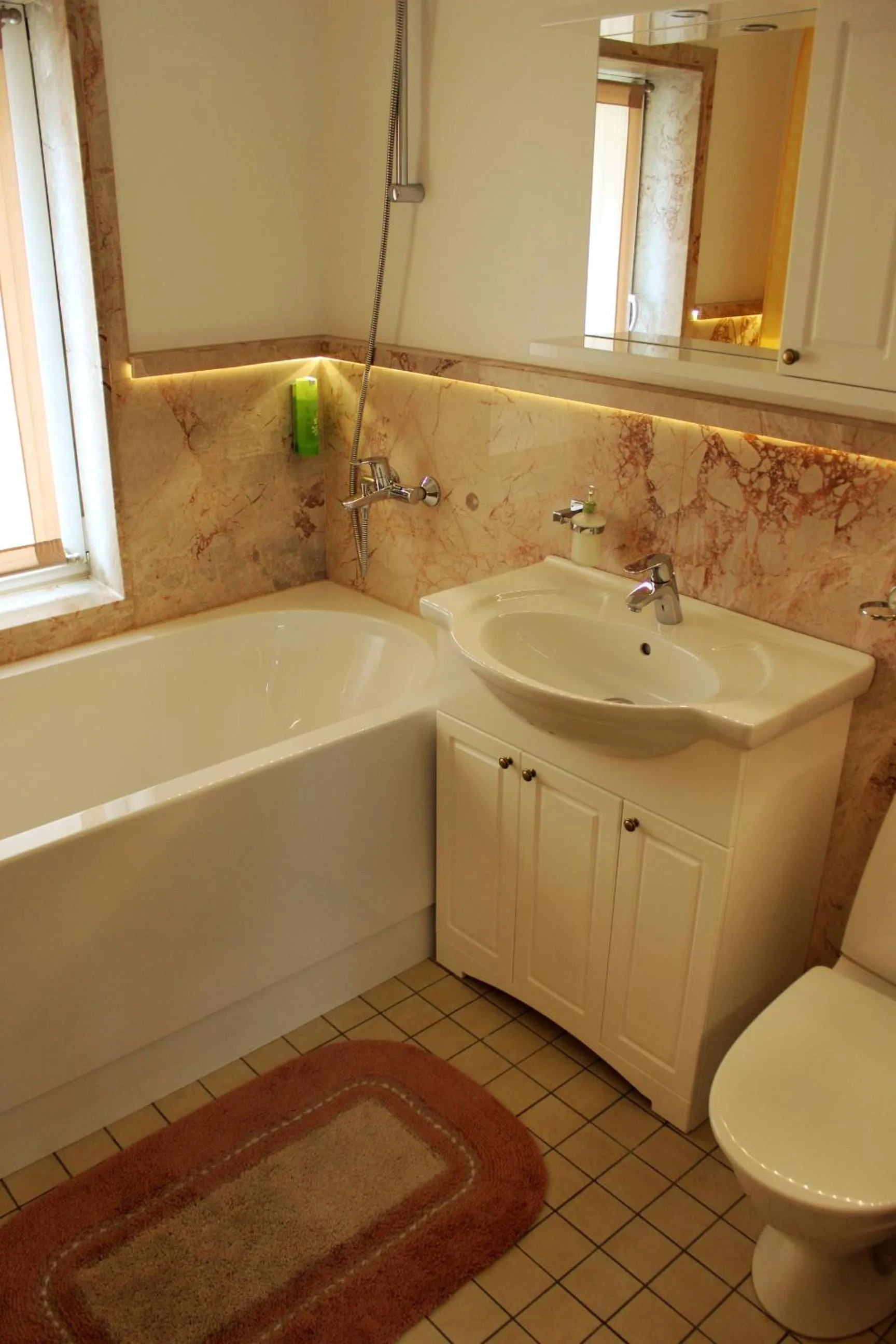 Bathroom in Embrace Hotel & Apartments