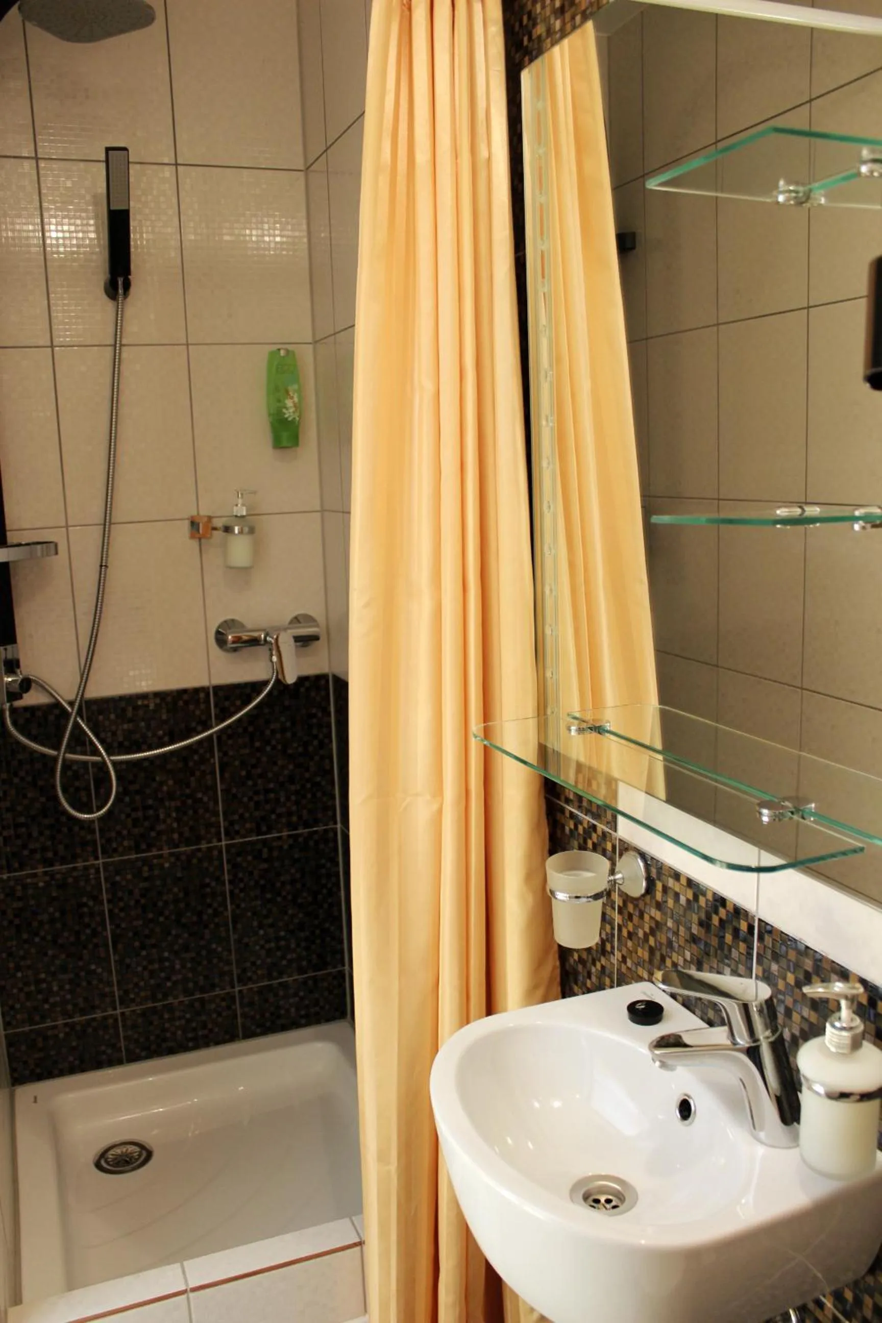 Bathroom in Embrace Hotel & Apartments