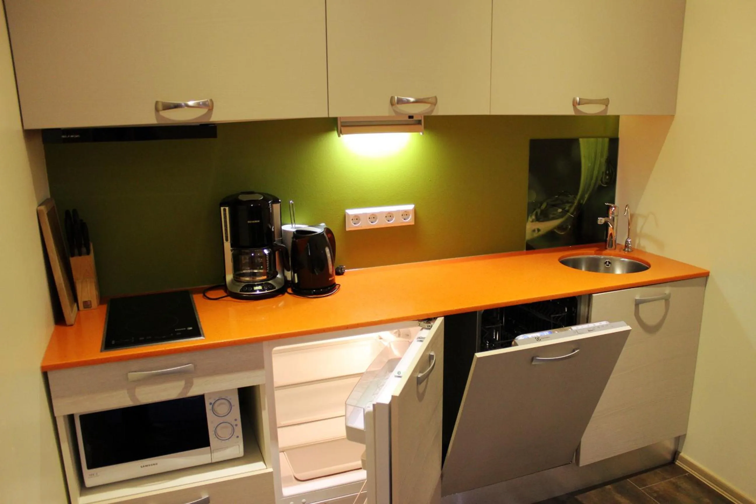 Kitchen or kitchenette in Embrace Hotel & Apartments